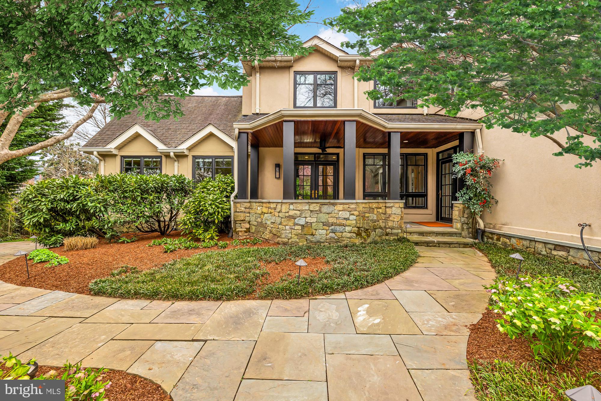 Welcome to this extraordinary residence in the highly sought-after neighborhood of Edgemoor. Right next to the shops and restaurants of downtown Bethesda.  Upon arrival, a paved stone walkway through a generous front yard leads to a spacious stone patio, setting the tone for the home within. Beyond the foyer and staircase, a gourmet kitchen awaits, boasting Wolf appliances, custom cabinetry with pull-out pantry cabinets, a wine cooler, dual dishwashers, and a breakfast bar with pine mahogany. This is a dream for anyone seeking to host large dinner parties and family gatherings. Flowing from the kitchen, the living room welcomes you with a cozy gas fireplace with stone surround, remote-controlled patio screens, and accordion doors that seamlessly blend indoor and outdoor living. Adjacent to the kitchen is the large dining room featuring a wood-burning fireplace and an adjacent powder room for convenience. As an added bonus, the shelf next to the fireplace is a secret passageway to the home gym. Additional spaces on the main floor offer versatility, from a potential billiards room to an office space, a mudroom, the home gym with padded rubber floors, and a 360° sun room with plush carpet, a vaulted ceiling and panoramic views of the outside.

Ascending to the second floor, four bedrooms await. The primary bedroom is the crowning jewel of this level boasting 13' ceilings, ebony stained oak floors, and three walk- in closets including a large cedar closet and two additional His/Her closets.. The accompanying primary bath boasts all the expected amenities for a residence of this caliber with frosted glass doors, dual vanities, heated floors, a smart mirror, and multiple shower heads with controls for individual pinpoint personalization. From the bedroom, you may step out to a walkable wraparound balcony offering breathtaking views of the backyard. Additionally, on this floor, you will find that Bedroom one has a private balcony facing the front of the home and shares a full bathroom in the hallway with Bedroom two. Bedroom three is spacious and includes an ensuite bathroom as well as shared access to the wrap-around balcony overlooking the courtyard.

Descending to the basement, entertainment awaits with a spacious theater room and convenient amenities like a powder room, laundry facilities, and ample basement storage. 

Stepping outside you will find a serene oasis complete with a gas fire pit and built-in BBQ, perfect for gathering with friends and family year-round. Lights underneath the patio steps illuminate, creating an inviting garden atmosphere for outdoor entertaining. Additionally, this property includes a one-car garage with a one bedroom studio built above the structure with a full bathroom, perfect for in-laws or out-of-town guests. 

Access to the prestigious Edgemoor Club is included in the purchase price of this home, offering exclusive amenities and recreational opportunities. Nestled in the heart of Bethesda, 5010 Edgemoor Lane epitomizes luxury living with its impeccable craftsmanship, modern conveniences, and coveted location. Don't miss your chance to experience the finest in upscale living—schedule a showing today and make this exceptional property your own.