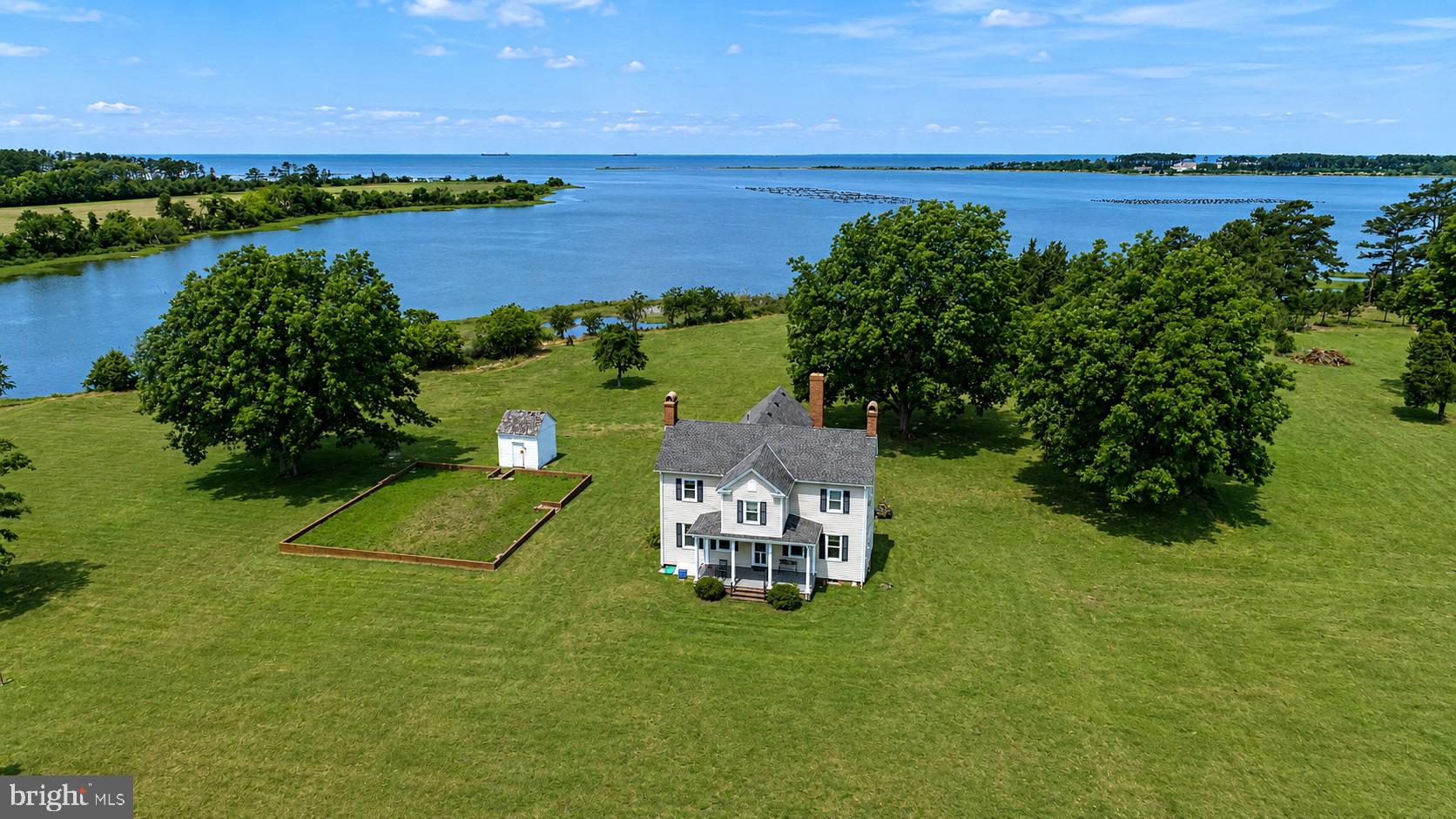 Experience the timeless elegance of this beautifully restored 18th-century home. An extraordinary opportunity to own one of Virginia's Eastern Shore's most significant waterfront estates. Encompassing 93.99 acres across 11 separate parcels, this legacy property offers a rare blend of luxury living, investment potential, and future development opportunities. At the heart of the estate sits a beautifully preserved circa-1780 residence positioned on nearly 14 acres with over 1,400 feet of private shoreline. Offering more than 3,600 square feet, the home features 4 bedrooms, 3.5 bathrooms, four fireplaces, a spacious waterside family room, and numerous modern upgrades including updated electrical, plumbing, and multi-zone HVAC systems. Complementing the main residence is a separate 2-acre pondfront parcel improved with a charming 1-bedroom, 1-bath guest cottage and farm building, creating the perfect setting for guests, caretakers, or additional rental income. The remaining parcels present an exceptional investment and development opportunity, including seven waterfront lots ranging from approximately 7 to over 16 acres each, plus an additional 5.5-acre non-waterfront parcel. Every lot offers approved perc and well sites, desirable Bojac soils, and is located within Flood Zone X, providing added value and flexibility for future construction. Whether envisioned as a private waterfront compound, equestrian retreat, family estate, conservation holding, or premier residential development, this remarkable offering delivers unmatched shoreline, acreage, privacy, and long-term investment potential in the sought-after Cape Charles market. A truly rare opportunity to acquire a generational estate with both immediate enjoyment and future upside.