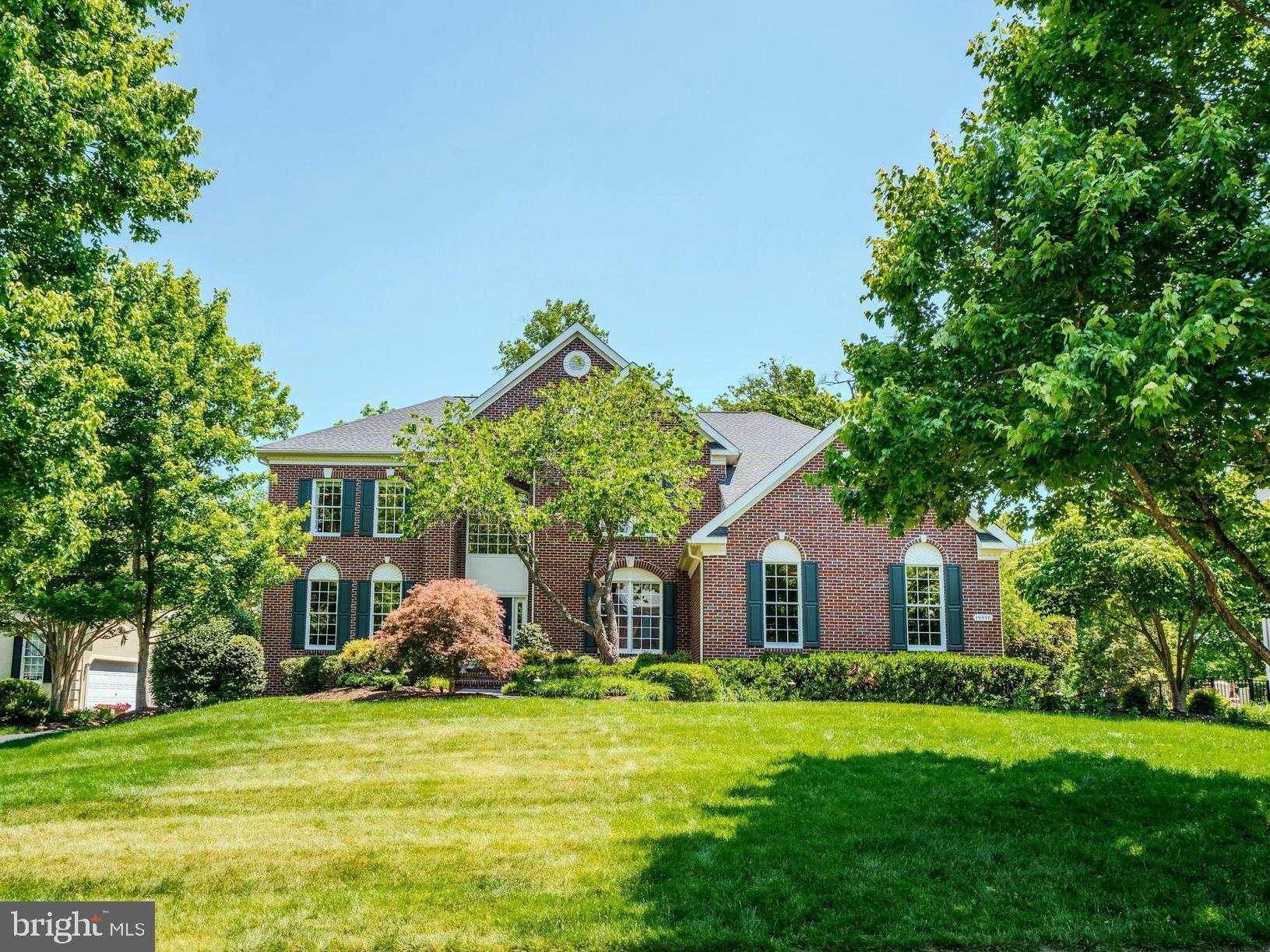 Welcome home to this stunning brick front Toll Brothers built home on a private .48 acre lot on a cul-de-sac street in the highly coveted gated Belmont Country Club golf course community of Ashburn. This beautiful home features 4 bedrooms, 4.5 baths, over 5600 square feet of indoor living space, fresh paint throughout much of the home & an incredible rear yard with trees backing to the golf course. Inviting two story foyer with curved staircase & detailed molding welcomes you as you enter this home. Spacious living room & formal dining room with detailed moldings & custom lighting. The gourmet kitchen was renovated in 2020 & features stainless steel appliances, upgraded quartzite countertops, tons of cabinet space, center island, pantry & spacious eating area. The grand two story family room features a wall of windows providing tons of light, new carpet (2026), cozy wood burning fireplace & rear staircase. Private main level office with built-ins provides ideal work from home space. The main level also features a powder room & mudroom leading out to the oversized 3-car garage. Spacious primary suite features a luxurious renovated full bath & two walk-in closets. The secondary bedrooms all feature new carpet (2026) & includes bedrooms two and three with a shared updated bath as well as a fourth bedroom with private full bath. The finished lower level is an entertainer’s dream with multiple areas including a recreation room, pool table area, exercise area, custom bar with refrigerators, 4th full bath, media room & storage! The outdoor living space includes an incredible covered porch & deck overlooking the picturesque rear yard with trees & views of the golf course. This home has been meticulously  maintained by the original owners whom have updated the roof, water heater & upper level HVAC. The monthly HOA Fee includes lawn mowing, high speed internet, cable TV, trash removal, community swimming pool, playground & more. Belmont Country Club offers many social events & golf course memberships are available! This home is conveniently located nearly local dining, shopping, entertainment & commuter routes.