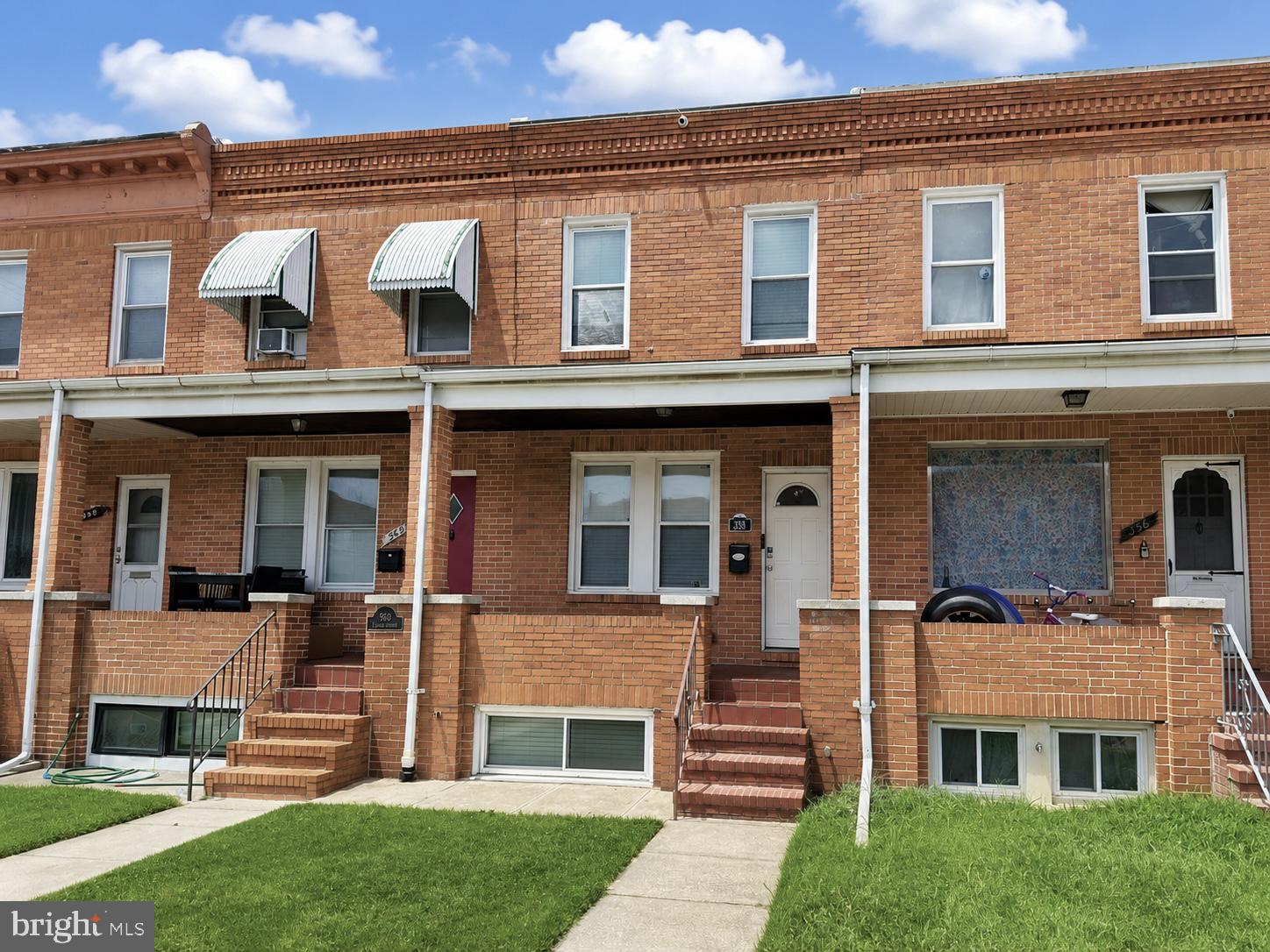 Welcome to this beautifully updated 3-bedroom, 2 full bath home in the desirable Bayview neighborhood of Baltimore, conveniently located just minutes from Johns Hopkins Hospital, downtown Baltimore, shopping, dining, and major commuter routes. This move-in ready home blends classic charm with thoughtful modern updates, featuring hardwood floors throughout, exposed brick accents, a fully finished basement, and a custom primary bedroom closet with quartz countertop. The updated kitchen and lower-level utility area showcase quartz countertops, while the guest bedroom offers brand-new carpeting. Recent improvements include a Mitsubishi 4-zone mini-split heating and cooling system (2024), new front porch roof (2023), roof silver coating (2023), new gutters and downspouts (2023), new hot water heater (2023), new washer and dryer (2025), and new microwave (2026). A full video security system with doorbell camera provides added peace of mind, and the private concrete parking pad offers the convenience of off-street parking. Combining modern upgrades, quality craftsmanship, and an exceptional location, this home is ready for its next owner to enjoy.