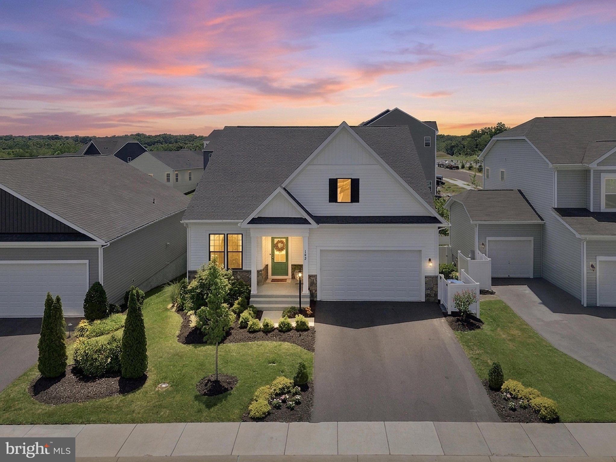 A rare offering in the highly sought-after Snowden Bridge community, this former builder model showcases exceptional craftsmanship, thoughtful design, and the ease of luxurious main-level living—with no age restrictions. Tucked away at the end of a peaceful cul-de-sac, this stunning three-level home offers 4 bedrooms, 4 full bathrooms, and a 2-car garage.

From the moment you step inside, you'll appreciate the inviting open floor plan and upscale finishes throughout. Just off the foyer, a private home office with French doors provides the perfect space for working from home or a quiet retreat. The luxurious main-level primary suite is a true sanctuary, featuring dual custom walk-in closets and a spa-inspired bath with double vanities, an oversized walk-in shower, and a relaxing soaking tub. Two additional main-level bedrooms, each featuring custom closets, a beautifully appointed full bath, and a spacious laundry room complete the main level.

At the heart of the home is the gourmet kitchen, designed to impress with elegant Carrara quartz countertops, premium stainless steel appliances, an oversized center island, abundant prep space, and timeless gray and white cabinetry. The sun-filled breakfast area, surrounded by expansive windows, flows seamlessly into the dramatic family room, where soaring vaulted ceilings create a bright, open atmosphere perfect for everyday living and entertaining.

Step outside to the screened-in covered porch and enjoy peaceful views of the surrounding green space while overlooking your fully fenced backyard with 6-foot vinyl privacy fencing—an ideal setting for morning coffee, outdoor dining, or relaxing at the end of the day.

An elegant oak staircase leads to the upper level, where you'll find a spacious loft overlooking the family room, an additional bedroom, and a full bathroom, making it an ideal space for guests or multigenerational living.

The walkout lower level offers incredible flexibility with a large recreation room, a full bathroom, a dedicated room ideal for a media room or home theater, and an unfinished space with a window that provides excellent storage or the opportunity to create a fifth bedroom, home gym, or additional finished living area.

Living in Snowden Bridge means enjoying an unmatched lifestyle with resort-style amenities, including a community pool, indoor sports complex, walking and biking trails, dog park, playgrounds, picnic areas, and more. Combining luxury, comfort, and an unbeatable location, this exceptional home is a rare opportunity in one of the Shenandoah Valley's most sought-after communities.