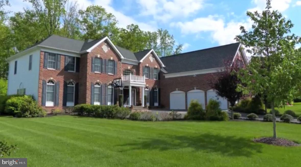 Nestled on a premium lot in Upper Mountain Estates, this exquisite Colonial offers a harmonious blend of luxury and comfort.  Spanning over 5700 square feet with 5 spacious bedrooms and 6.5 bathrooms, this home is designed for both relaxation and entertaining. Step inside to discover a warm and inviting atmosphere, accentuated by rich hardwood floors and tasteful tile throughout. The gourmet kitchen is a culinary enthusiast's dream, featuring stainless steel appliances, a built-in microwave, double ovens, and a gas range, all complemented by a generous island and a butler's pantry for seamless hosting. The family room, conveniently located off the kitchen, invites cozy gatherings. Retreat to the primary suite, where luxury meets tranquility. This private sanctuary boasts a dressing room, sitting room, 4 spacious walk-in closets, and a spa-like primary bath, offering a perfect escape after a long day. Each additional bedroom is thoughtfully designed to ensure comfort and privacy for all. The fully finished basement expands your living space, featuring a second kitchen, full bath, media area, and large rec room, making it an ideal space for recreation or relaxation. Enjoy peaceful moments on the patio, backing to a serene wooded area that provides both privacy and a picturesque view of nature, and creating a tranquil retreat right in your backyard.  This residence is not just a home; it's a lifestyle. Experience the perfect blend of luxury, and comfort, in this stunning property, where every detail has been meticulously crafted to create a warm and inviting atmosphere.
