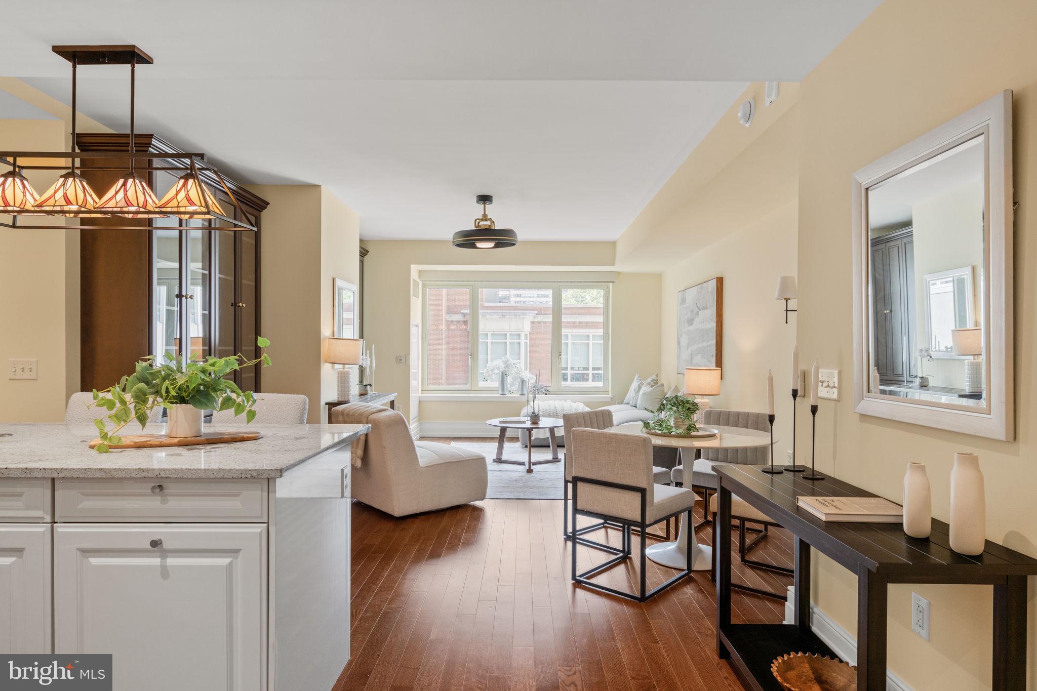 Welcome to Residence 609 at 10 Rittenhouse, one of Philadelphia’s most prestigious luxury condominium addresses, ideally situated in the heart of Rittenhouse Square. This spacious deluxe one-bedroom, one-and-a-half-bath residence offers approximately 1,052 square feet of sophisticated living space with exceptional scale, elegant proportions, and a thoughtfully designed floor plan that maximizes both comfort and functionality. Bathed in natural light from oversized windows overlooking peaceful courtyard and garden views, the home blends timeless elegance with modern luxury. The expansive living and dining areas create an inviting setting for both everyday living and entertaining, while the beautifully designed eat-in kitchen features high-gloss white Poggenpohl cabinetry, barstool seating, paneled SubZero refrigerator and Miele dishwasher, gas cooking, and generous prep space. The spacious bedroom suite serves as a serene retreat, complete with beautiful custom closet systems and a luxurious marble bathroom featuring a soaking tub and glass-enclosed shower. A separate powder room for guests, in-unit washer and dryer, and an abundance of storage further enhance the home’s livability. The current owner has completed extensive upgrades throughout the residence, including electronic blinds throughout the unit with warranty, new designer lighting fixtures, fresh paint throughout, new hardwood flooring in the bedroom, custom built-in shelving and cabinetry in both the living room and bedroom closets, as well as a stylish new kitchen backsplash and under-bar tile accents — elevating the home with a refined, contemporary aesthetic. Designed by renowned architect Robert A. M. Stern, 10 Rittenhouse is considered one of the city’s premier luxury residential buildings, offering unparalleled white-glove service and world-class amenities. Residents enjoy 24-hour concierge and doorman service, chauffeured town car service, valet parking, a state-of-the-art fitness center, yoga room, indoor lap pool, sauna and steam rooms, wine room, catering kitchen, piano lounge, library, TV and gathering lounges, board room, landscaped outdoor courtyard and terrace, bike storage, hotel guest suite, and more. Pet friendly with parking available for rent subject to availability. A large private storage unit is included. Philadelphia’s renowned Rescue Spa is conveniently located within the building for the ultimate luxury lifestyle experience. Live just steps from the very best of Rittenhouse Square — award-winning restaurants, premier shopping, arts and culture, vibrant cafés, and the beloved Saturday Farmers Market. Experience refined city living at one of Philadelphia’s most coveted residential addresses, where timeless elegance, exceptional service, and unmatched convenience come together to create an extraordinary lifestyle.