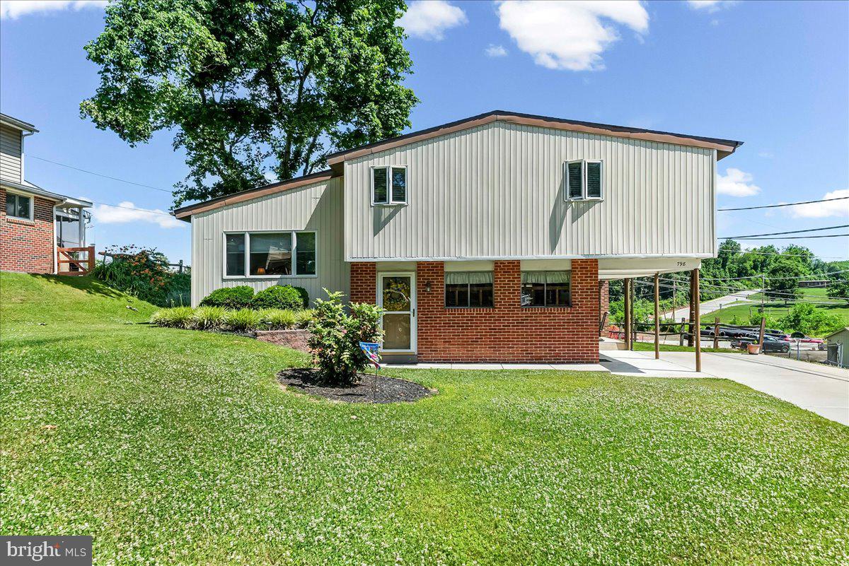 .Well-Maintained Split-Level Home - Move-In Ready! Welcome to this inviting split-level home, perfect for families and entertainers alike! This meticulously maintained property boasts a practical layout and numerous features that make it truly special. As you step inside, you will find a bright and airy entrance level featuring a kitchen with an adjacent eat-in area. The open space flows effortlessly into the cozy dining room or family room, adorned with beautiful laminate flooring that adds warmth and style. Conveniently access the basement and crawl space from this level, great for additional storage and functionality. Step outside through the side door and discover a lovely, covered patio area—ideal for morning coffee The second level hosts a spacious living room, providing the perfect spot for relaxation and family gatherings. Ascend to the third level, where you will find three comfortable bedrooms and hall bathroom. Additional storage is available with a closet in the hallway, ensuring that you have plenty of space for all your belongings. Along with an additional linen closet Outdoor enthusiasts will appreciate the fabulous covered rear porch, perfect for entertaining friends and family. This home is equipped with gas heat and central air conditioning, ensuring comfort in every season. Don’t miss your chance to own this charming home! Schedule your showing today and experience all that it has to offer!