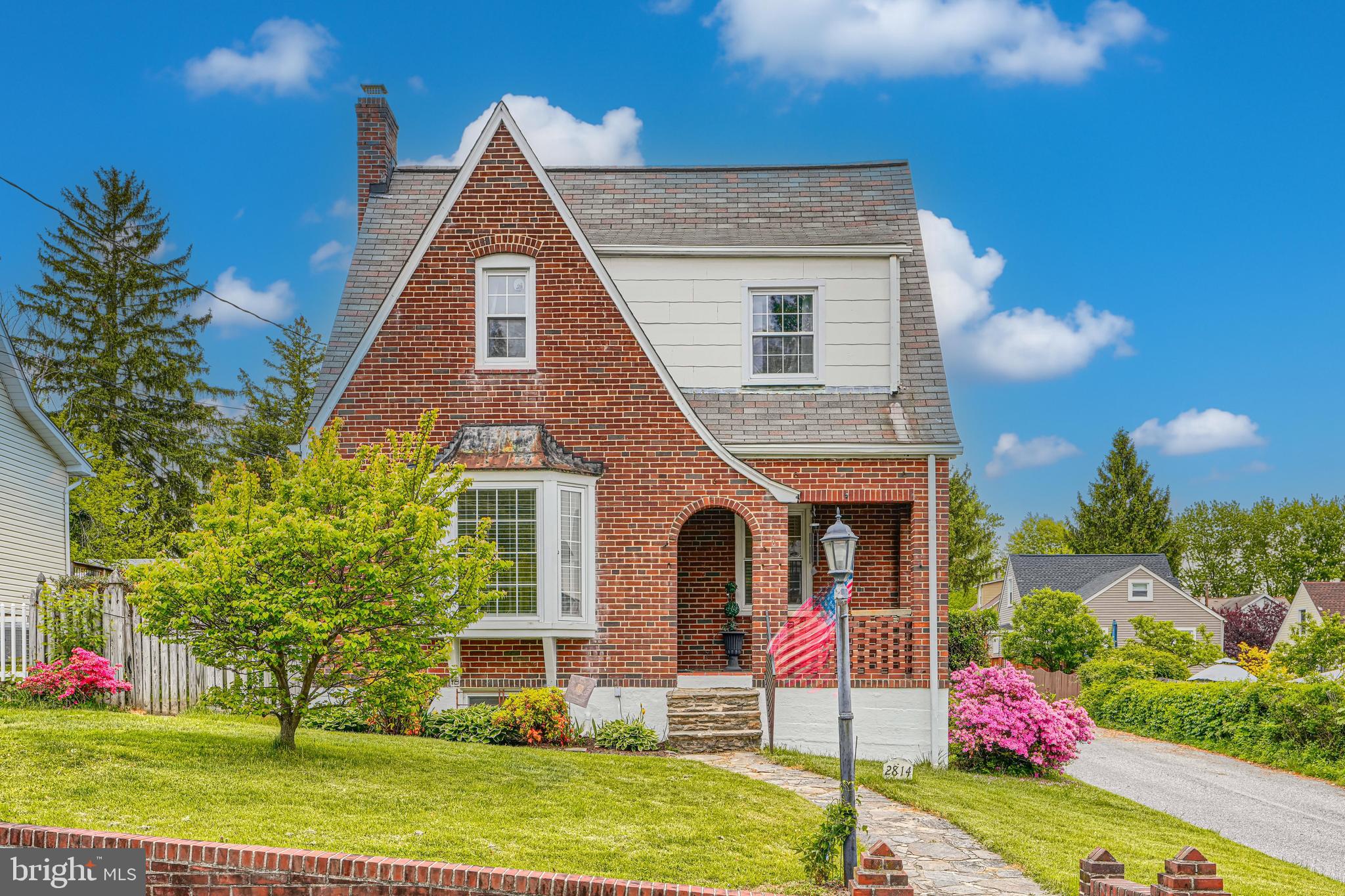 The seller set an offer deadline for Saturday, May 2nd, at 7 PM! Charming brick Tudor-style Cape Cod filled with character and timeless appeal! An inviting front porch welcomes you into a warm, comfortable living room featuring hardwood floors and a wood-burning fireplace. The separate dining room showcases chair railing, crown molding, and a classic built-in, adding both charm and functionality. The kitchen offers white cabinetry, a gas stove, and a practical layout designed for everyday living. Upstairs, hardwood floors continue throughout three generously sized bedrooms, along with a full hall bath featuring timeless black and white tile. The partially finished basement includes a half bath and flexible living space ideal for a family room, home office, or potential fourth bedroom. Outside, enjoy the large fenced backyard with multiple patios perfect for relaxing or entertaining, plus a two-car detached garage. Schedule your appointment today!