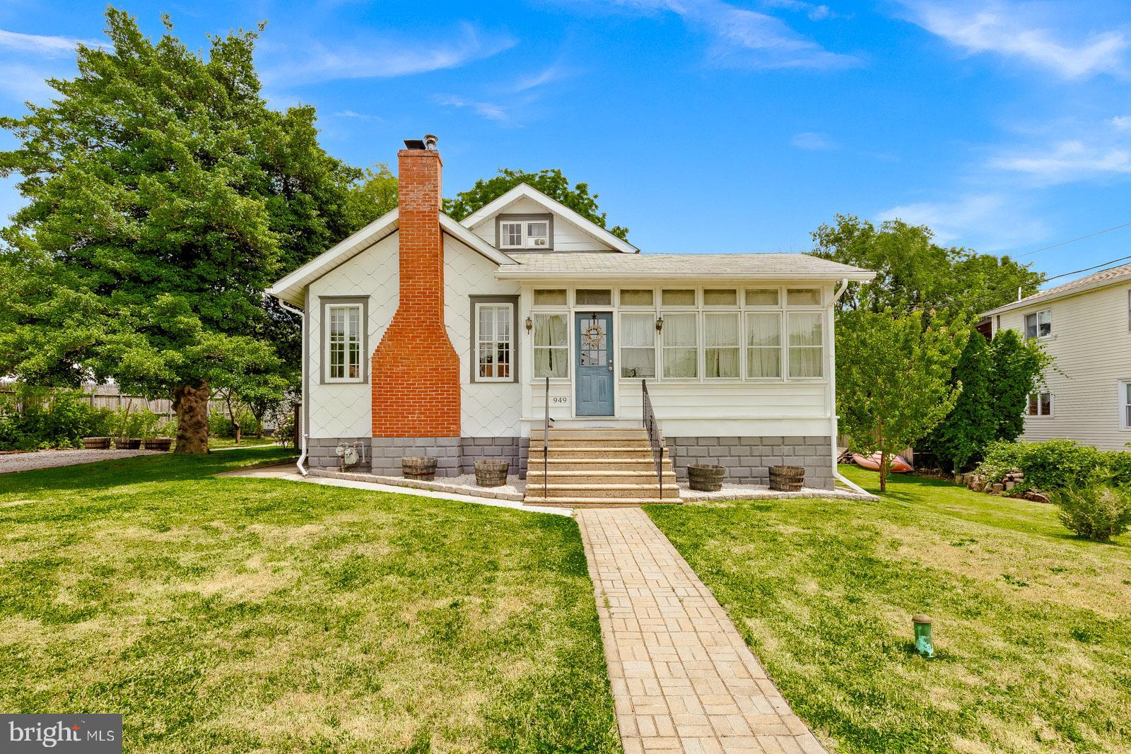 Welcome to 949 Edgewood Avenue, a truly special home where timeless character and thoughtful modern updates come together on a beautifully maintained quarter-acre lot in the heart of Bensalem. Lovingly cared for over the years, this five-bedroom home offers the warmth and charm of a classic property while providing the space and flexibility today's buyers are looking for. Conveniently located close to all major roadways, Jefferson Torresdale Hospital, shopping, dining, parks, and everyday conveniences, this home offers the perfect combination of comfort and accessibility. Step inside through the inviting enclosed wraparound porch, a bright and welcoming space that's perfect for relaxing with your morning coffee, entertaining guests, or enjoying the changing seasons. The main level features spacious living and dining areas filled with natural light, an updated kitchen, three generously sized bedrooms, and a full bathroom. Upstairs, you'll find two additional bedrooms and a convenient half bath, offering flexible living space for family, guests, or a home office. One of the property's most impressive features is the detached 16' x 20' heated studio with electric, currently used as an art studio. Filled with natural light, this versatile space is ideal for artists, remote work, a home business, fitness, hobbies, or countless other possibilities. In addition, the property includes a separate 12' x 16' electrified woodworking shop with a spacious enclosed, paved patio, providing even more flexibility for projects, storage, or creative pursuits. The outdoor living areas are equally impressive. Designed for both relaxation and entertaining, the backyard features a covered patio overlooking low-maintenance AstroTurf, beautifully landscaped gardens, and an incredible collection of mature fruit trees and berry bushes. Enjoy harvesting apples, Italian plums, apricots, two varieties of cherries, mulberries, early and late season peaches, blackberries, and two varieties of raspberries, creating your own private backyard orchard. The full basement offers approximately 1,000 square feet of additional space and includes a finished bonus room, a half bath, laundry area, and a professionally waterproofed unfinished section ready to be customized to suit your needs. A convenient exterior entrance provides direct access from the basement to the backyard, adding even more functionality. This exceptionally maintained home has preserved its original character while incorporating thoughtful updates throughout. With five bedrooms, versatile detached outbuildings, beautiful outdoor spaces, abundant storage, and a location that combines neighborhood charm with outstanding convenience, 949 Edgewood Avenue is a rare opportunity to own a property that offers character, versatility, and pride of ownership. Schedule your private showing today and experience everything this unique property has to offer.