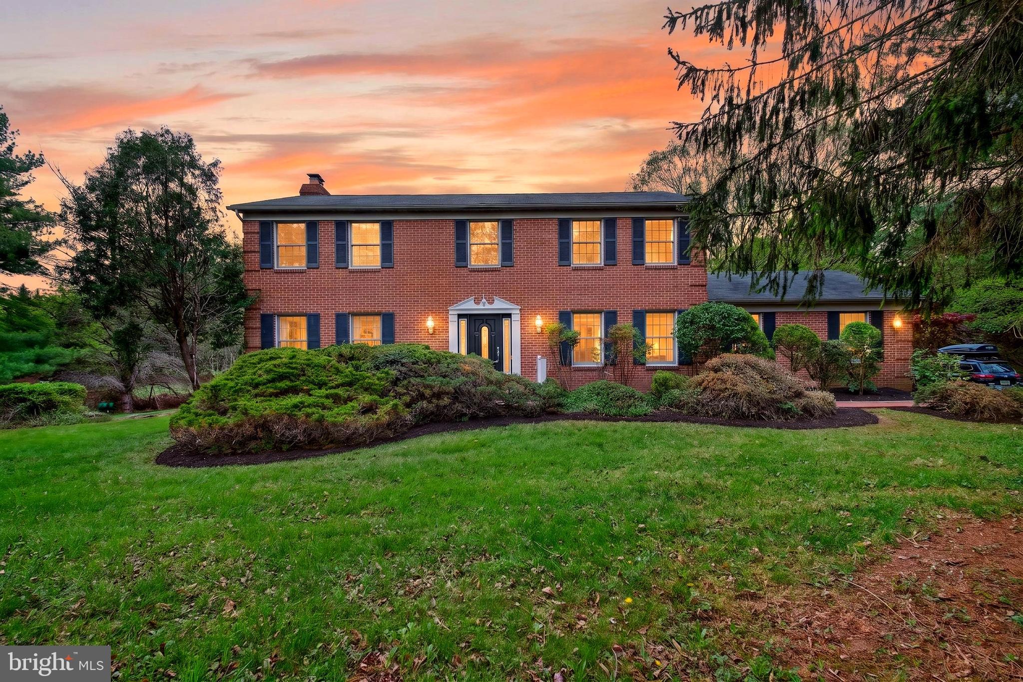 Welcome to 6 Jonathans Court — a beautifully maintained brick colonial tucked away on a private cul-de-sac in Jonathans Delight, offering exceptional space, privacy, and a truly special setting on 3.55 acres backing to trees and parkland. With over 3,000 finished sq ft, 4 bedrooms, and 3.5 baths, this home delivers a timeless layout with flexible living across three finished levels.

Inside, you’ll find sun-filled living and dining rooms with hardwood flooring, plus a warm and inviting family room centered around a wood-burning fireplace with glass doors. The country kitchen features a center island, table space, and easy connection to the main living areas—ideal for everyday living and entertaining. A standout feature is the expansive window-lined living space at the rear of the home, offering peaceful views of the surrounding landscape and seamless flow to the outdoor patio areas shown in the photos.

Upstairs, the generous primary suite and three additional bedrooms provide comfortable room to spread out, complemented by well-sized baths and thoughtful storage. The finished lower level offers a large recreation/game room plus additional space for hobbies, media, fitness, or storage.

Outside, enjoy the serenity of the long private drive, mature landscaping, and multiple outdoor areas for relaxing or gathering. A 2-car side-entry attached garage and ample off-street parking add convenience.

A rare opportunity to own a well-cared-for home with acreage, privacy, and a classic floor plan—just minutes to shopping, dining, and commuter routes.