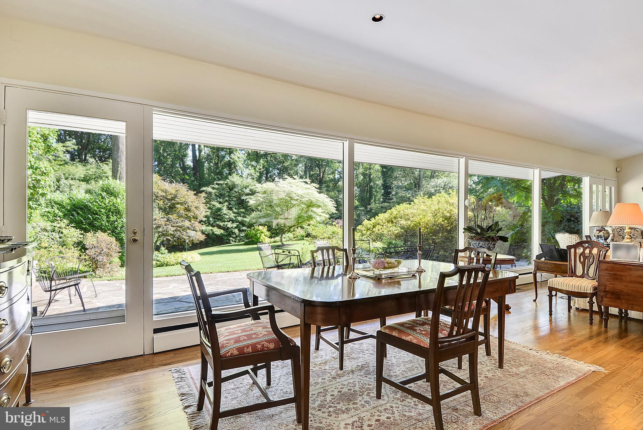 MAJOR PRICE REDUCTION----Mid-century modern designed by Alexander Cochran w/a 2001 addition on 4.2 private acres-Open flr plan-Loads of glass w/awesome views from every room-Updated kit w/center island, custom cabs & breakfast area-Fam rm w/vaulted ceiling, FP & bar off the kit-MBRM suite w/dress rm & bath & steam shower-Close to multiple schools-40' stone patio-2 car gar-Beautiful grounds.
