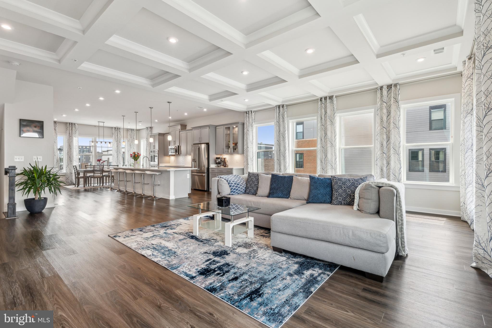 🌅 Rare Luxury End-Unit Townhome-Style Condo – Where Sunrise Meets Sunset! 🏡✨

Welcome to a rarely available, fully upgraded end-unit stunner with an open floor plan flooded with natural light! This 23-ft wide beauty boasts soaring 10-ft ceilings, a chic coffered tray ceiling in the living room, and a designer kitchen that will take your breath away – think 16-ft island, GE Café smart appliances, induction cooktop, double oven with air fryer, and more!

Step out to your private balcony for morning coffee or evening grilling, or head up to the expansive rooftop terrace – your personal oasis with sweeping city views!

The luxurious primary suite features a massive walk-in closet and a spa-inspired bath with frameless glass shower, bench seating, and double vanities. Two generously sized guest bedrooms are located on the same level.

Live in style with top-tier community amenities: outdoor pool, fitness center, clubhouse, playgrounds, dog park, and even private conference rooms – all just steps from Shady Grove Metro. Walk to CVS, Starbucks, daycare, nail salon, and more!

📍 Convenience. ☀️ Luxury. 🏙️ Lifestyle.
Don’t miss this rare opportunity – your dream home is waiting!

***Listing Agent (Nish) related to owner***