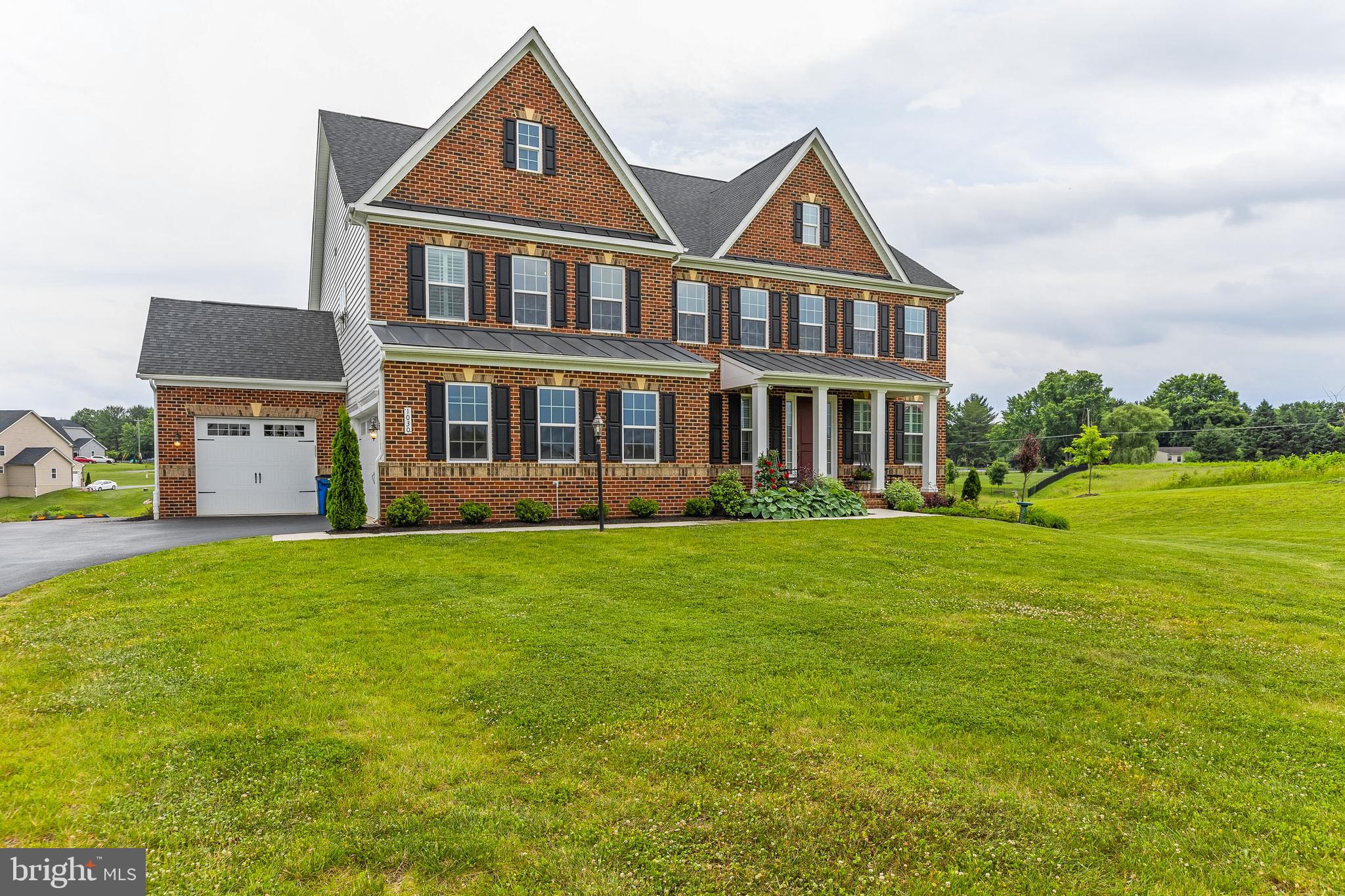 This impeccable NV Homes Stratford Hall model is finely appointed and is where luxury lives.   Situated in  the sought after Fairlane Estates  offering magnificent sunsets and wide-open views!  Upon entering the light-filled foyer, where the adjoining sitting room offers versatility and a formal dining room perfect for entertaining.   A wonderfully tucked away office makes working from home easy and peaceful.  Off the 3-car garage, a family entry welcomes you to the gourmet kitchen featuring extended custom cabinets, granite countertops, stainless steel appliances,  an expansive center island overlooking the 2-story family room with beautiful coffered ceilings, easy access to the butlers pantry and dining area.   Upstairs, 3 additional bedrooms each including ensuite baths and loft space for relaxing. The luxury owner’s suite featuring an  exquisite tray ceiling,  2 enormous walk-in closets,  luxurious ensuite bath with soaking tub, oversized spa shower and a double vanities.   The fully finished walk out basement, offers a wet bar, gym, bedroom with private bath, spacious recreation room and loads of storage!   Enjoy your summer evenings relaxing on the covered porch and patio!    This one will not last!