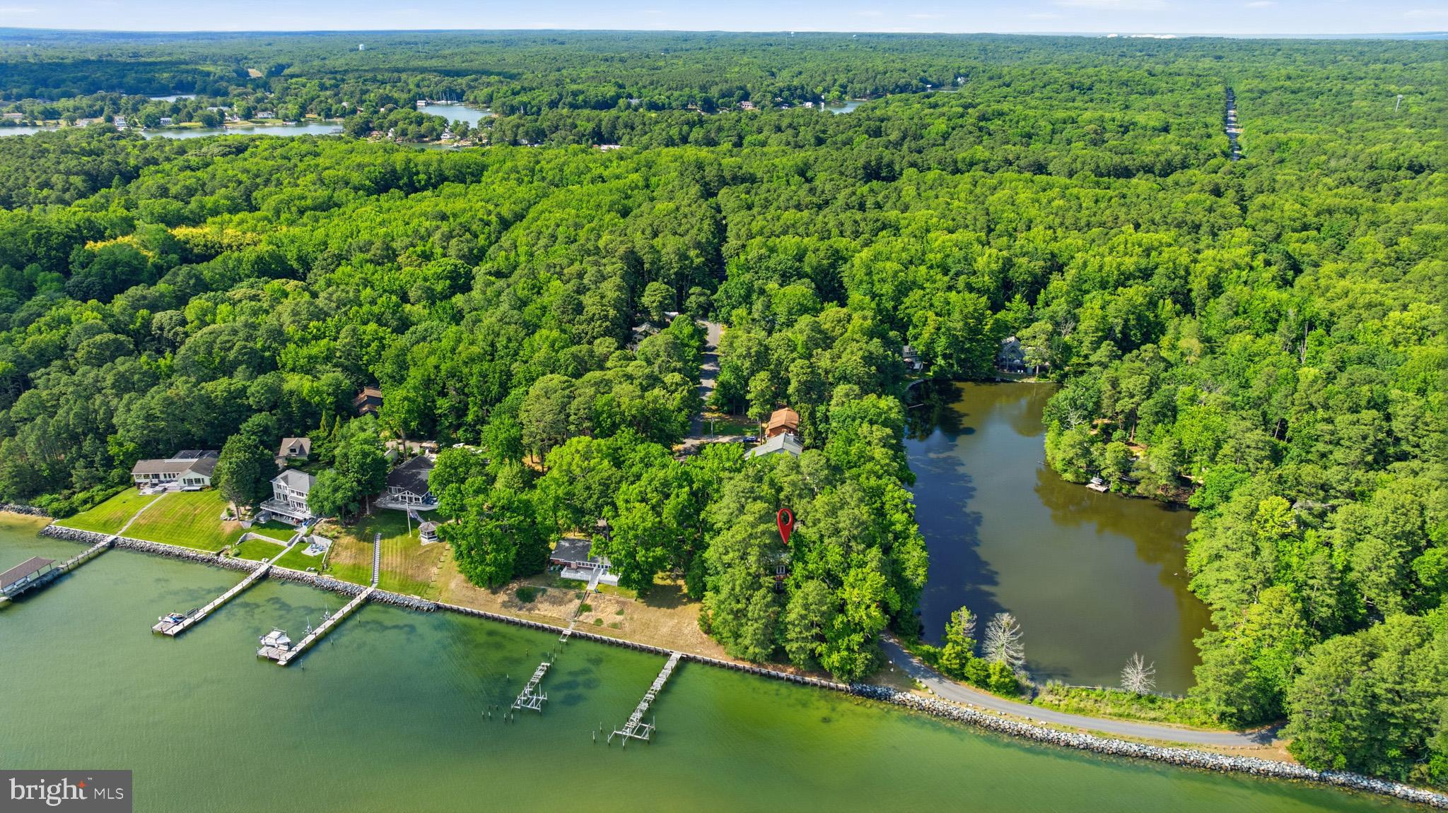 WATERFRONT PROJECT!! Patuxent River Waterfront opportunity in the sought-after Drum Point community! Situated on a scenic 0.28-acre waterfront lot, this distinctive 3-bedroom, 3-bath home offers approximately 2,085 square feet of living space surrounded by mature trees and the natural beauty of the Chesapeake Bay. Designed to embrace its exceptional setting, the home features spacious living areas, soaring ceilings, expansive windows, and multiple outdoor spaces perfect for enjoying waterfront living. The bright sunroom and main living areas are filled with natural light and showcase tranquil water views, while the upper-level deck provides the perfect place to relax and unwind. Step outside to your private shoreline where kayaking, paddleboarding, fishing, and waterfront adventures await. Residents of Drum Point also enjoy access to a private community beach, further enhancing the coastal lifestyle. Whether you're searching for a full-time residence, weekend retreat, or waterfront getaway, this property offers a rare opportunity to own Patuxent River Waterfront in one of Southern Maryland's most desirable waterfront communities.

Home will need updating and renovation but once complete this home could be worth around $1M based on recent comparables. Don't miss this opportunity! Set up a showing ASAP!