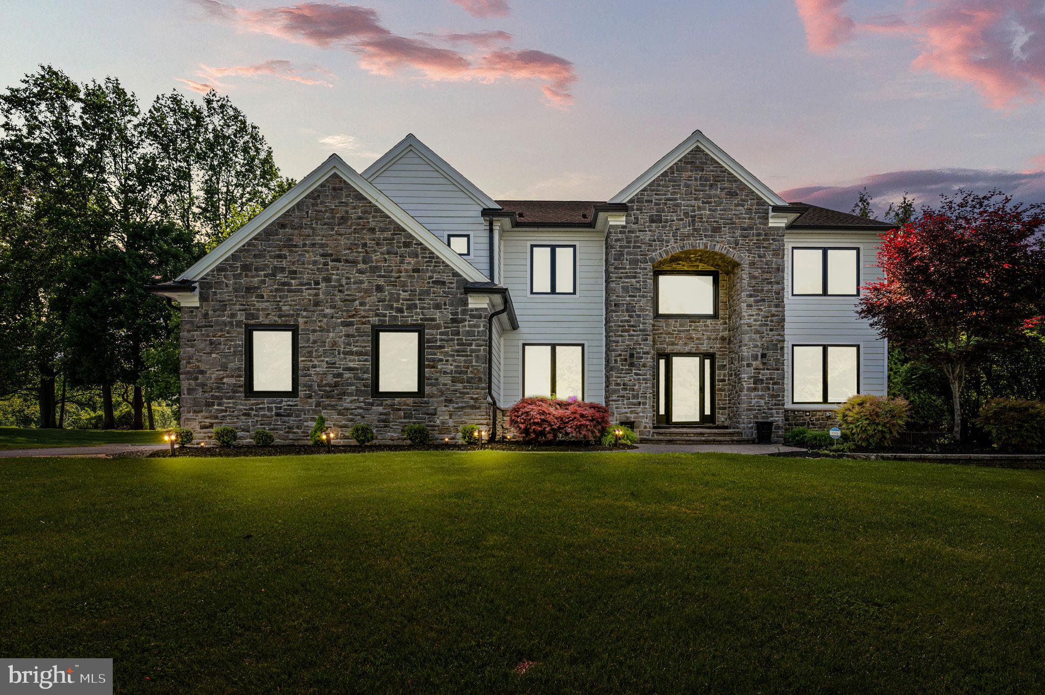 Welcome to a beautifully reimagined estate in the heart of the Garnet Valley School District—where thoughtful design, modern comfort, and smart finishes come together effortlessly.

A complete 2024 exterior transformation—featuring James Hardie siding, stone accents, a new roof (2023) and all new Marvin Ultimate Windows—pairs with manicured grounds and a three-car garage to create a sense of understated elegance.

Inside, a soaring two-story foyer introduces the home with a iron banister (2024) and a striking chandelier. Refinished hardwood floors (2023) carry throughout, while formal living and dining rooms just off the entry offer a classic, refined setting for gatherings both intimate and grand.

As you move toward the rear of the home, the atmosphere shifts—opening into a light-filled living space anchored by a dramatic family room with floor-to-ceiling windows and a sleek, modern electric fireplace. Just beyond, a private first-floor office offers a quiet place to work or unwind, tucked seamlessly into the flow of the home.

At the center, the kitchen is both functional and beautifully composed recently renovated in 2024. A generous island topped with dolomite serves as a natural gathering place, complemented by custom cabinetry, a Viking cooktop, statement hood, and a built-in wine refrigerator. A dedicated dry bar enhances the space for entertaining, while Marvin Ultimate accordion-style glass doors dissolve the boundary between indoors and out—opening fully to the deck and gardens beyond.

Upstairs, the primary suite is designed as a true retreat. Calm, spacious, and thoughtfully finished, it is complemented by a spa-like bath featuring heated floors, towel warmers, and a Kohler Anthem smart shower system designed for a fully personalized experience. And a Kohler "Veil" series bidet smart toilet. Primary bathroom renovation completed in 2023. Subtle luxuries—backlit mirrors with integrated audio, smart fixtures, and refined materials—create a space that feels both elevated and effortless.

Additional bedrooms offer comfort and flexibility, while the finished lower level provides expansive space for recreation, fitness, or media—adaptable to the way you live.

Outdoors, the property unfolds into a private resort setting. An expansive Trex deck (2024), connected by a custom bridge, overlooks a saltwater pool framed by curated hardscaping and layered landscaping. A bonsai garden and butterfly garden add moments of quiet beauty, while multiple entertaining areas invite everything from relaxed afternoons to lively evenings.

Behind the scenes, advanced systems—including geothermal HVAC, whole-home water filtration (2025), Irrigation system front/backyard 8 zones/Hunter Hydrawise WiFi automatic controller/ or app-controlled Rainbird sprinkler head (2025)—support a lifestyle of ease and efficiency.