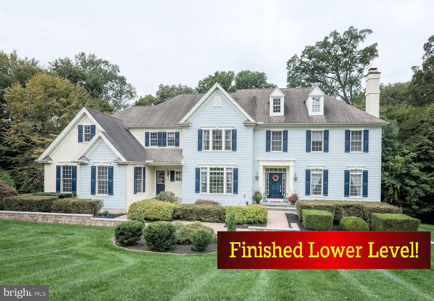 You CAN have it all! Welcome to 915 Shenandoah Lane, boasting over 5,800 square feet of luxury living and unrivaled vistas of the spectacularly verdant Chester County landscape! PLUS: on a cul-de-sac setting in the prestigious Shenandoah community; 1 acre backing to woods; 5 Bedrooms and 4/1 Baths; Walk-Out Finished Lower Level; and in the acclaimed West Chester School District! Down the custom hardscaped walkways and there are 2 covered front Porches that greet you. Into the front-to-back Reception Foyer and a first floor replete with hardwood floors, 9-ft ceilings, and a fabulous open lay out. Arched entryways lead you into both the sophisticated Living Room with mantled fireplace, and the formal Dining Room---both with exquisite millwork & crown molding accents. There is a Study/Office with french doors and custom built-in bookcases, and the Family Room with vaulted ceiling showcases a floor-to-ceiling stone fireplace plus three walls of sun-filled windows. Perfect for daily culinary creations or holiday/party feasts, the epicurean Eat-In Kitchen includes: granite counters all around including the expansive two-tier breakfast bar island w/double sink; high-end stainless-steel appliances; double wall ovens; 5-burner gas range; built in microwave; 42-inch raised panel cabinets; and walk-in pantry. Do not miss the Butlers Pantry complete with glass curios and a wine/beverage fridge! Imagine savoring your morning coffee in the spacious Breakfast/Morning Room, with its wall of sun-drenched transom topped windows and slider door overlooking the treetop vistas. Step out onto the oversized composite Deck and you are in your own personal treehouse! This Deck features a curved counter & seating area to enjoy the stunning sunsets, plus a gas fireplace w/stone surround and steps out to the grassy, open yard. Such an idyllic setting for unwinding & relaxing, al fresco dining, and both cozy gatherings and large celebrations! Also on this floor are the Powder Room; large 14x10 Mudroom with separate front porch entrance & access into the 3-Car Garage (new garage door); back staircase off the Kitchen; and french doors out to the second composite Deck and its spectacular woodland vistas! Up the turned staircase with landing & catwalk awash in natural light, and double doors open into the Primary Suite---a quiet sanctuary with trey ceiling; Sitting/Dressing area; huge 13x12 dual-sided Walk-In Closet w/custom organizers; and a spa-inspired Full Bath with two separate vanities, a floor-to-ceiling tiled shower, a jetted soaking tub, heated towel rack, and private WC. Down the hall are 4 additional Bedrooms all with ample closets; 2 more well-appointed Full Baths; walk-in 11x9 Attic that could be finished as a Sitting Room or fabulous Walk-in Closet; and a convenient second-floor Valet Laundry w/counter & cabinets, sink, and wall mounted drying rack. Get ready for endless fun in the Finished Lower Level: open staircase down to Game/Rec Room with fireplace, dry bar, and slider door out to the Patio & yards; Bonus Room with fireplace and windows; plus an adjacent Full Bath w/closet (so could be 6th Bedroom/Guest Suite!). There is also a fitness area and storage. Outside is a true oasis, with expert hardscaping & landscaping (w/sprinkler system); 1 acre of both open yards and woods; and the property borders the Shenandoah community paved walking trail! Plus former owners had plans/permit for an incredible in-ground pool & spa complex---so imagine all the possibilities! Two zone HVAC including one new unit; new interior paint; extra recessed lighting & designer lighting fixtures; new security system; invisible dog fence. BONUS: included for your peace-of-mind is a one-year AHS ShieldComplete Home Warranty (their highest level of coverage!). Close to Rtes 322/202/1, Main Line/Philly/DE/shore points & everywhere you want to be! Some photos virtually staged. Verification of info including measurements &  lay-out (including sq ft) lies with the consumer.