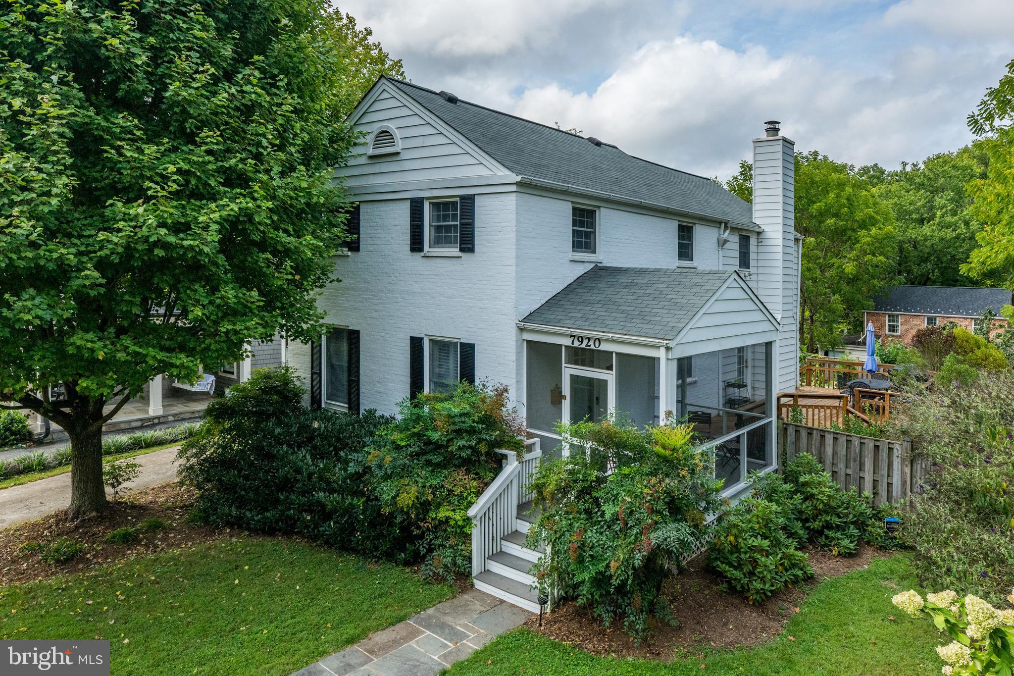 Just Listed! Beautiful 4BR/2FB/2HB home in the highly sought after Columbia Forest neighborhood on a corner lot. This home has so much charm throughout and will check all of your boxes. The screened in front porch is perfect for having your morning coffee and also has access to the rear deck. The main level offers a large living room with coat closet, formal dining room, half bath, large kitchen with center island, induction stove, double wall ovens, dishwasher, 2 sinks, tons of cabinet space and is open to family room with wood-burning fireplace with brick surround and French doors on either side out to rear deck. The second level has 4 bedrooms and 2 full baths - inclusive of the primary suite with attached bath, skylight, walk-in closet plus additional 2nd closet. The floored attic is also great for extra storage. The finished lower level is perfect for a play area, rec room or additional living space and has a half bath. The utility room has side by side washer and dryer, utility sink and plenty of storage space for all your seasonal items. The home has been recently refreshed including refinished hardwood floors, new carpeting and paint. Outside is where you'll really find respite in the summer months with the large deck and lower stone terrace, perfect for entertaining. The fenced-in backyard has been utilized by the current owners as an escape with lush greenery, raised beds and surrounding plantings (currently pumpkins!) and storage shed. There's even paw paw trees in the front lawn! Home comes with off-street driveway parking. The location is close to Metro, gyms, shops, restaurants, rec. center and playground/park (one is across the street). Move-in ready! This home will not last.