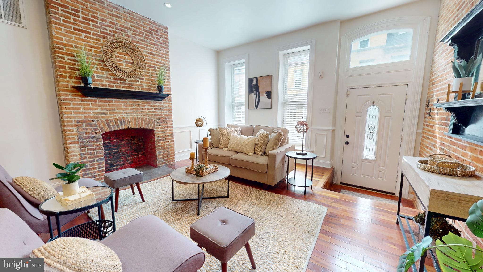 This 2,250-square-foot Charles Village gem offers a rare blend of historic charm and functional versatility. The standout feature is a fully self-contained in-law suite with a private entrance, providing total autonomy for multi-generational families or long-term guests. The interior includes three spacious bedrooms with ample storage, highlighted by a primary suite with a connected bonus room perfect for a nursery, home office, or luxury dressing room. Situated in a vibrant, walkable community just steps from the Johns Hopkins Homewood campus, this property presents a premier opportunity for students or affiliates to establish a home in a prime location. Whether you are seeking a generous family residence or a strategic move-in-ready residence for your studies, this versatile home delivers on every level.