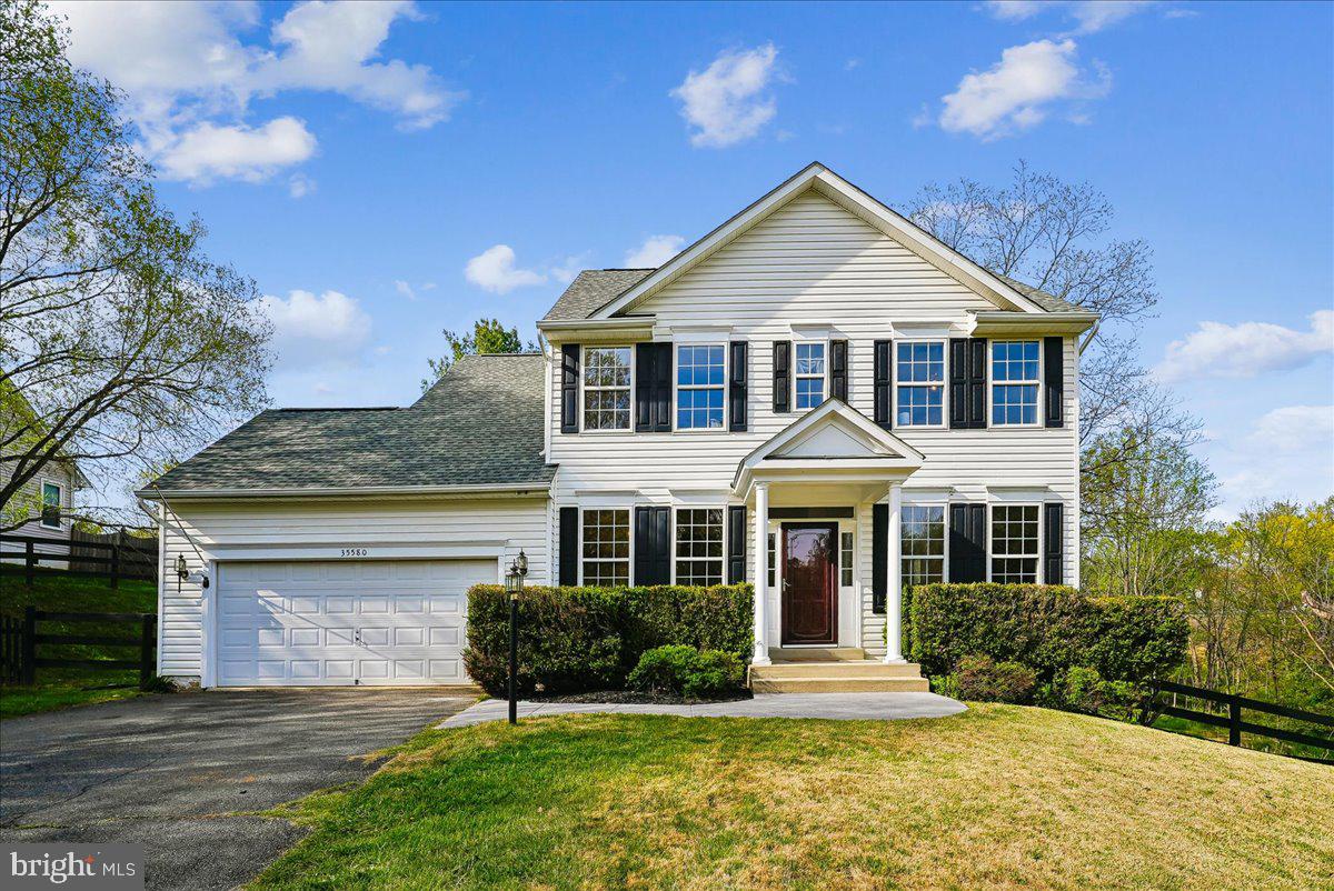 **IMPROVED PRICE!!**Welcome home to timeless comfort and scenic charm in the sought-after Falls Wood community of Round Hill. Perfectly positioned on a picturesque 1-acre lot, this lovely four-bedroom, three-and-a-half-bath colonial offers the ideal blend of classic style, modern updates, and peaceful outdoor living—all with no HOA.

Step inside to discover hardwood floors that flow throughout the main level. The inviting foyer is flanked by a formal dining room adorned with crown and chair rail molding as well as architectural columns—perfect for hosting gatherings—and a versatile flex space ideal for a home office, den, or additional living area.

At the heart of the home, the open-concept kitchen features warm oak cabinetry, stainless steel appliances, and propane gas cooking, seamlessly connecting to the spacious family room. Here, you’ll find a cozy propane gas fireplace, ceiling fan, and direct access to the expansive custom deck—an ideal setting for entertaining or simply unwinding while taking in serene views of the  backyard and the gentle creek beyond.

Upstairs, retreat to the peaceful primary suite complete with a tray ceiling, ceiling fan, walk-in closet, and an en-suite lux bath featuring dual vanities, a soaking tub, walk-in shower, and private water closet. Two additional bedrooms and a well-appointed full bath complete the upper level.

The fully finished walkout lower level expands your living space with a generous recreation room, fourth bedroom, and a third full bath—perfect for guests or multi-generational living. Additional highlights include a dedicated laundry and storage area, plus a separate utility room for added convenience.

Ideally located with easy access to Route 7 and just minutes from the shops, dining, and charm of both Round Hill and Purcellville, this home offers the perfect balance of tranquility and accessibility.

Recent updates provide peace of mind, including a roof (2021), HVAC (2018), water heater (2024), and sump pump (2024).

This is more than a home—it’s a lifestyle.  There truly is no place like home.