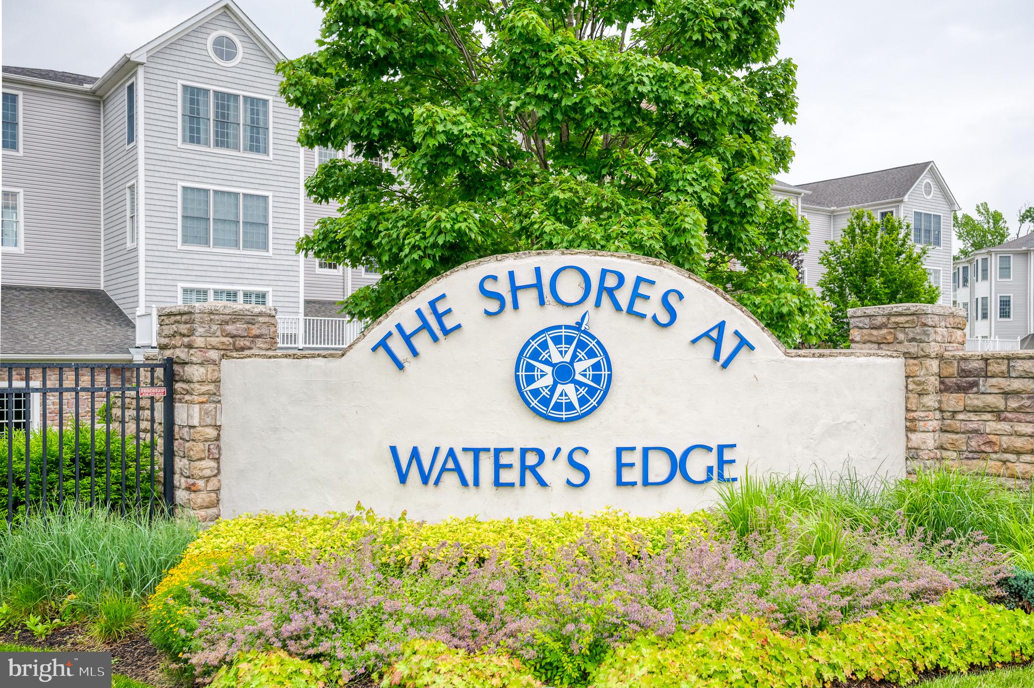 Welcome to Water's Edge, the exclusive community near the Bush River with breathtaking views that will captivate you. What’s special about this unit? This is one of the best water view condos at Water’s Edge. This column of condos is rarely available and this is largest model with detailed moldings, columns, chair railings and other high-end features throughout. A welcoming foyer with hardwood floors leads you inside. The renovated kitchen (2021) with tray ceiling, 42-inch white cabinetry, granite counters, backsplash, updated stainless steel appliances and a breakfast bar that opens to the dining area. It has luxury vinyl plank flooring with hardwoods underneath. The family room is just steps away with an exit to the covered porch. It has a dual sided electric fireplace accenting the living room as well. That space is open to the dining room. The primary suite has stunning views to wake up to each morning as well as two walk-in closets and a spa-like bath which includes a soaking tub, separate shower and double sink. The second bedroom has easy access to another full bathroom and the potential third bedroom is currently being used as an office/den. The community is gated, along with a secure building with elevator access. There is garage parking with designated spot, laundry in unit (washer/dryer included) along with a secure/private storage inside the unit. The clubhouse is within a short stroll to enjoy the resort-style amenities including pool, meeting and exercise rooms, putting greens, private kitchen and more. You'll find beautifully landscaped walking/bike trails and you can kayak the tranquil waters in your backyard. A boat docking facility is minutes away at the local yacht club. This community is convenient to highways, shopping & Amtrak. A true haven for those who are wildlife  enthusiasts and bird watchers - from the quick flying swallows, hummingbirds visiting the patio, ospreys tending to their nests,  and the majestic eagles that fly by and hang out on trees within 100 feet of the condo! It’s a treasure.