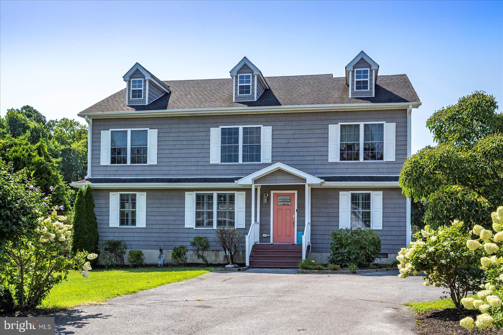 Motivated Sellers Boaters, beach lovers, and big families—this one’s for you! This 7-bedroom, 4-bathroom waterfront home sits on 65 feet of canal frontage with a 7,500 lb boat lift—just 1,600 feet from the bay. Whether you're cruising out for a day on the water or relaxing on the oversized back deck, this home makes it easy to live the coastal lifestyle.

Inside, you'll find over 3,000 square feet of space with a bright, open layout. The main level includes a large kitchen, two living areas, and two bedrooms—including a spacious primary suite with walk-in closet and private bath. Upstairs offers five more bedrooms, perfect for guests, remote work, or a growing household. An attached outdoor storage room keeps your beach and boating gear close at hand.  Home is sold completely furnished.

Beyond your back deck, Ocean Pines offers an unmatched lifestyle. Spend your days at one of several pools—including a year-round indoor pool—grab lunch or dinner at the waterfront Yacht Club, or tee off at the championship golf course. The community also features tennis and pickleball courts, parks, trails, marinas, and a private beach club in Ocean City with exclusive parking and an oceanfront pool.

Whether you're looking for a year-round home or a coastal retreat, 45 Clubhouse Drive delivers the space, location, and waterfront access to make every day feel like vacation.