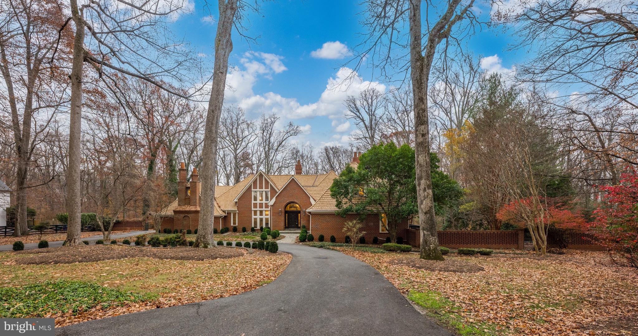 FIRST SHOWINGS this SUNDAY NOV 23rd--- OPEN 1-3! . This is absolutely one of Potomac's best buys in custom homes!  Welcome to 11552 Springridge Road an inviting country estate sited on a breathtaking 2 acres and offering all of the amenities of resort living along with a spectacular first floor primary bedroom suite.  This elegant home is landscaped to perfection and provides all the right outdoor spaces for additional entertaining including a swimming pool with spa, multiple waterfalls, a koi pond, a tennis court with viewing area, a main level three car garage with motor court and circular driveway. Three exciting and expansive levels are found within the residence.   A captivating grand foyer allows for access to all of the major rooms and views.  A wrap around deck adds to the entertaining spaces.  The formal dining room (14 by 19 feet), and formal living room (19 by 35 feet) with fireplace  are artfully designed for everyday living and more than spacious for formal entertaining.  The gourmet kitchen includes an island and separate breakfast room opening to a family room with fireplace.  Two powder rooms are located on the main level of the residence along with a large mud room/ laundry room. The surrounding decks on the main level overlooking the gardens bring the outside into almost every room. The sumptuous main level owners suite with sitting room, large bedroom with huge walk in double closets, and spacious master bath is worthy of a fine hotel, and overlooks the landscaped gardens.   On the second level of the home one will find an additional four bedrooms each with an ensuite bath, and one of these large enough to be a home office or studio.  The second level of the home provides an overlook to the living room and the outside of the home, similar to homes designed in California that overlook dramatic vistas. The daylight walkout lower level provides a huge recreation room with wetbar and fireplace and powder room #3,  pool table room, gym,  wine cellar, guest suite with sitting room, mini kitchen and bedroom and bath #6.  The lower level opens to the patio providing a large expansive outdoor bar perfect for outdoor activities.  This custom residence sited on a panoramic lot is waiting for you to call it home! The best buy in Potomac.  By appointment with 24 hour notice.  Please email for all appointments.