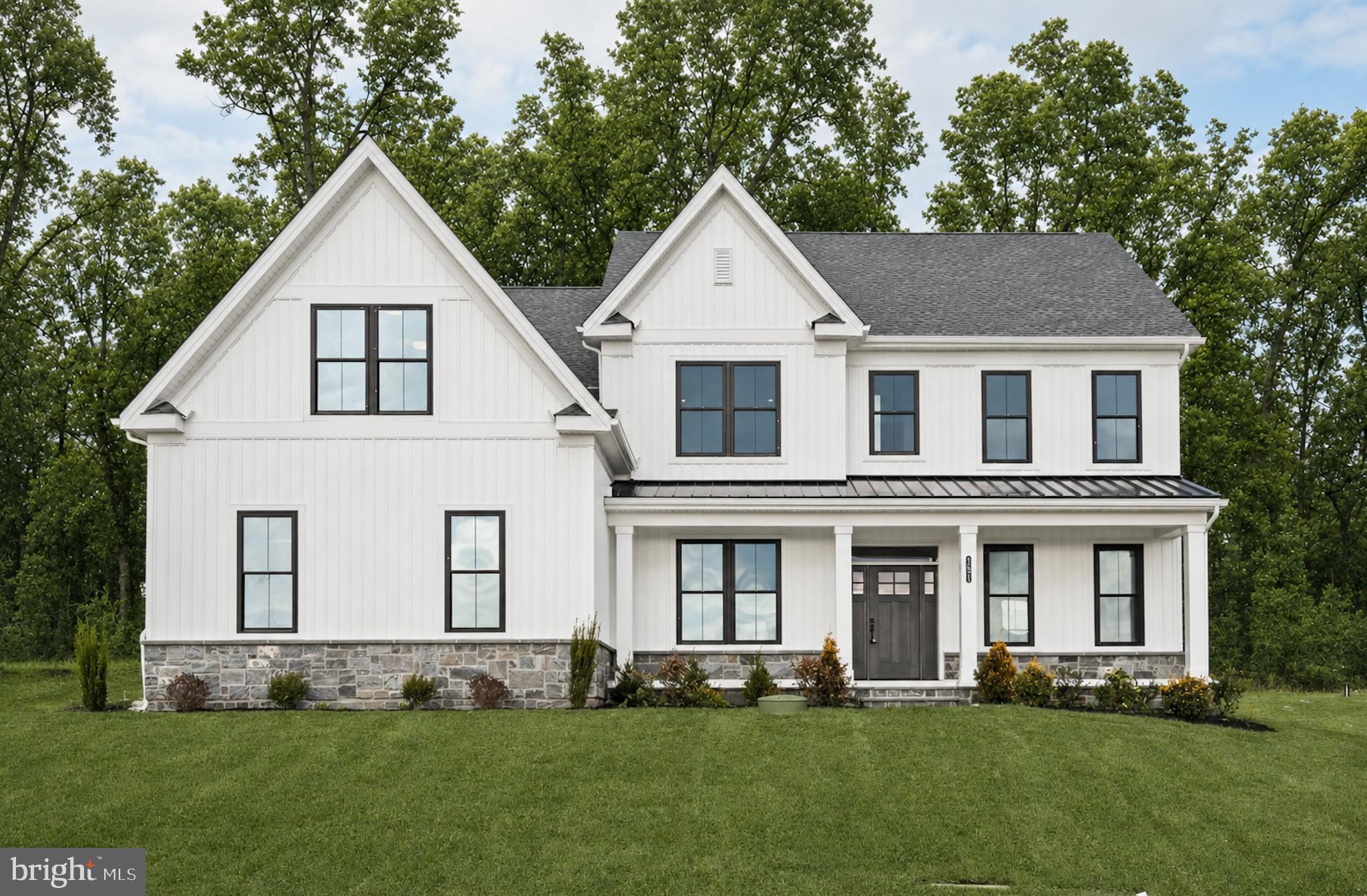 Move-in ready and effortlessly refined, this semi-custom estate home by Foxlane Homes offers over 4,800 square feet of elevated living on a private wooded homesite in the Downingtown School District. A Georgetown floorplan designed with 4 bedrooms, 3 full and 2 half baths, and a 3-car side-entry garage.
 
A grand foyer opens to a flexible study and an elegant dining space. The chef’s kitchen is beautifully appointed with premium KitchenAid appliances, upgraded cabinetry and countertops, flowing seamlessly into a sunlit great room with a gas fireplace and a serene sunroom beyond. Outdoor living space shines with a bluestone front porch and composite rear deck.
 
Upstairs, the owner’s suite is a true retreat with cathedral ceilings, closet designed to accommodate even the most curated wardrobe, and a spa-inspired bathroom featuring a free standing soaking tub to retreat to after a long day. A finished lower level adds versatile space for entertaining, fitness, or relaxation finished off with a powder rm.
 
This new construction move in ready home is located within The Estates at Stonecliff, an intimate enclave of 36  1/2 acre estate homes surrounded by Chester County’s rolling hills and expansive areas of open space.  Enjoy the peaceful surroundings of the Chester County countryside in a new home with close proximity to the many amenities of Downingtown, Chester Springs and Exton, and easy access to Route 100 and the Pennsylvania Turnpike.
 
This is refined luxury you dream of...Available now, but not for long.