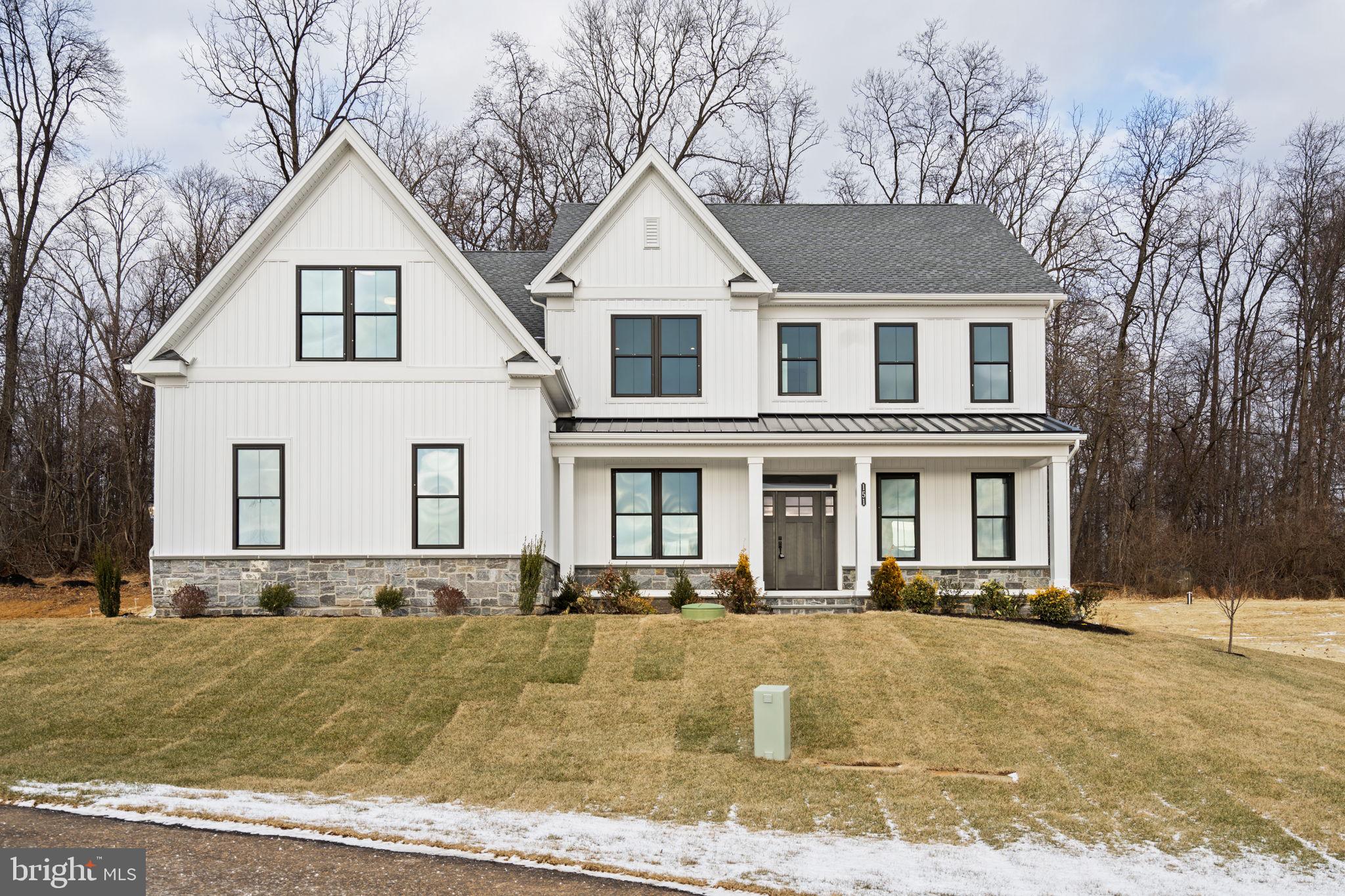 Move-in ready and effortlessly refined, this semi-custom estate home by Foxlane Homes offers over 4,800 square feet of elevated living on a private wooded homesite in the Downingtown School District. A Georgetown floorplan designed with 4 bedrooms, 3 full and 2 half baths, and a 3-car side-entry garage.
 
A grand foyer opens to a flexible study and an elegant dining space. The chef’s kitchen is beautifully appointed with premium KitchenAid appliances, upgraded cabinetry and countertops, flowing seamlessly into a sunlit great room with a gas fireplace and a serene sunroom beyond. Outdoor living space shines with a bluestone front porch and composite rear deck.
 
Upstairs, the owner’s suite is a true retreat with cathedral ceilings, closet designed to accommodate even the most curated wardrobe, and a spa-inspired bathroom featuring a free standing soaking tub to retreat to after a long day. A finished lower level adds versatile space for entertaining, fitness, or relaxation finished off with a powder rm.
 
This new construction move in ready home is located within The Estates at Stonecliff, an intimate enclave of 36  1/2 acre estate homes surrounded by Chester County’s rolling hills and expansive areas of open space.  Enjoy the peaceful surroundings of the Chester County countryside in a new home with close proximity to the many amenities of Downingtown, Chester Springs and Exton, and easy access to Route 100 and the Pennsylvania Turnpike.
 
This is refined luxury you dream of...Available now, but not for long.