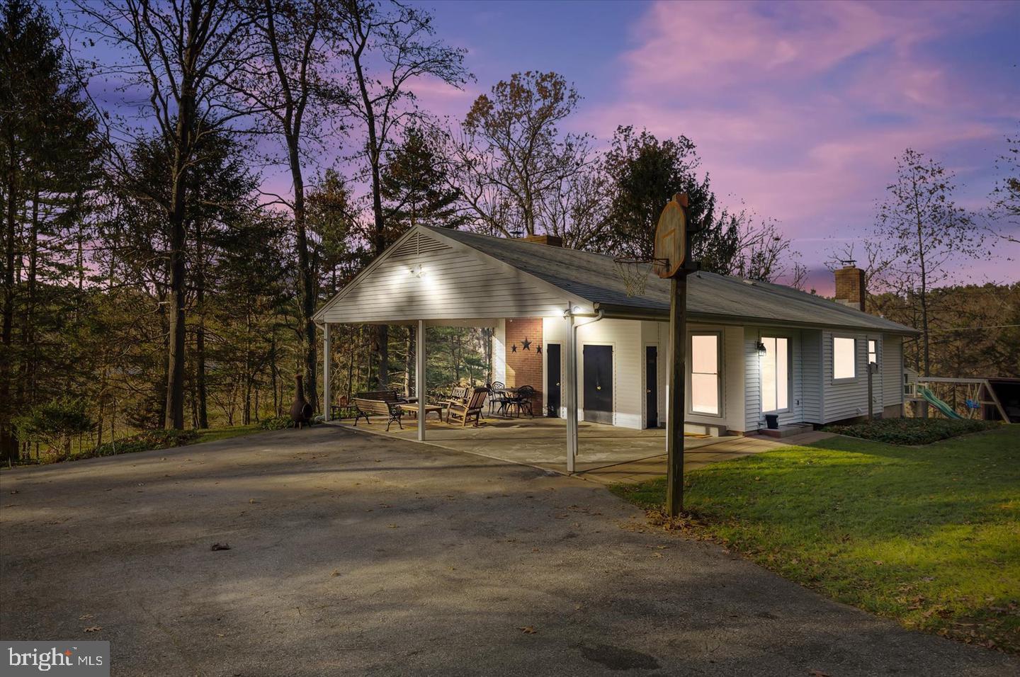 ***PROPERTY IS PENDING SIGNATURES ON AN ACCEPTED CONTRACT - ALL OPEN HOUSES ARE CANCELLED*** This charming 3-bedroom, 2.5-bath rancher sits on just over 3 acres in Upperco, offering privacy and room to roam. Tucked away on a private driveway, the home features a spacious, flat backyard—perfect for relaxing, playing, or entertaining. Two detached garages offer plenty of space for storage, hobbies, or a workshop. Out back, enjoy evenings around the fire pit or hang out on the covered concrete patio that looks out over peaceful views. A trail leads down to a small stream, giving you a fun spot to explore right in your own backyard.

Inside, you'll find hardwood floors throughout the main level and a gorgeous finished basement. Stay cozy in the cooler months with a wood-burning stove in the basement and a wood-burning fireplace on the main level. A whole-house generator gives you peace of mind during storms. You're tucked away, but still conveniently located near Routes 30, 140, 795, and 695, making commutes across Maryland easy.

Propane Tank Leased for Whole House Generator  (owned generator, leased by suburban propane $50/yr) - $70/Month Oil (Corbin Fuel Co.) - $160 /Month BGE - $25/Month Xfinity High Speed Internet - Septic left un-pumped for inspection purposes, will be pumped for new owners prior to closing.

- *** This property consists of three separate parcels totaling just over 3 Acres, identified as follows:

Property: 1 Acre - RES,

Land: 0.070 Acres - RES,

Land: 1.945 Acres - AG, 

The agricultural parcel (1.945 acres) is currently enrolled in a program through the FSA, which compensates the homeowner approximately $400 annually to refrain from developing, mowing, or altering the land. At closing, buyers will have the option to continue participating in this program, which ends in 2027. Should the buyer choose to opt out, they will be responsible for reimbursing any taxes already paid by the program. Advantage Title will provide the exact amount owed if needed.

Buyers are encouraged to perform their own due diligence to determine whether the agricultural parcel can be rezoned for development. - ***
