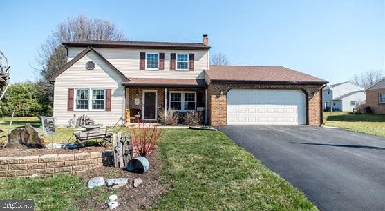 Attractive 2 story home on a spacious level lot. Great location and convenient to schools. Newer roof, tilt-in windows, siding and garage door. Lovely master bedroom suite, eat-in kitchen, formal dining room plus a first floor family room. Wood/coal stove in basement and an 18x24 patio. Must see!
