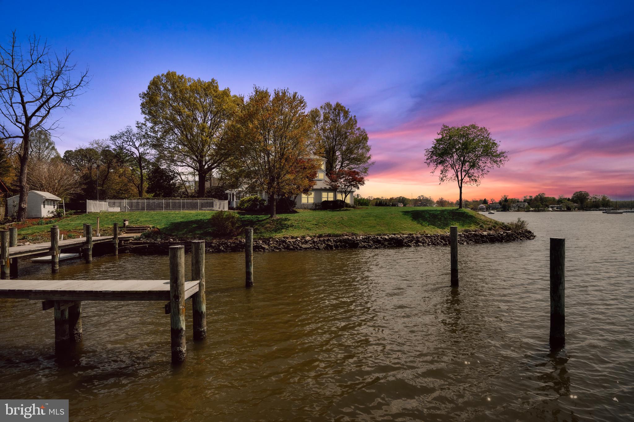 There's "waterfront", then there's 1203 Rogers Rd, a "point" of appx 350 feet of  waterfront seclusion at it's finest.  Situated on Cadle Creek with broad, spectacular views into the mouth of the Rhode River in the rear and into Cadle Creek on the side and front, this beautiful, custom-built, JUST remodeled craftsman -style home offers views and features you simply don't find anymore. Watch the Wednesday regattas and amazing sunsets from your elevated property above the flood plain. Rare combination of expansive views and a sheltered pier with large slips, with quick access to the middle of the Bay. Being on a point of land allows for water views from nearly every room in the house, including the most of the main level and all 3 upper level bedrooms. The master suite offers a "crow's nest" with views that will take your breath away. Step outside to enjoy your massive amount of water frontage, your deep water dock, and a waterside salt water pool that couldn't be built in that location by today's permitting standards (don't worry- it's grandfathered) that was totally renovated in 2015. The remodel of this spacious 3300 sq ft home was just completed and includes a gorgeous gourmet kitchen, new bathrooms, deck, and even a brand new roof with architectural shingles. It offers an open main level, a gorgeous master suite with office and crow's nest, two other spacious bedrooms upstairs along with another full bath, and a main level guest.in law suite with full bath. An all new commercial-grade pier was installed in 2014 and offers 8+ feet of mlw. Waterfront simply doesn't get much better than this!