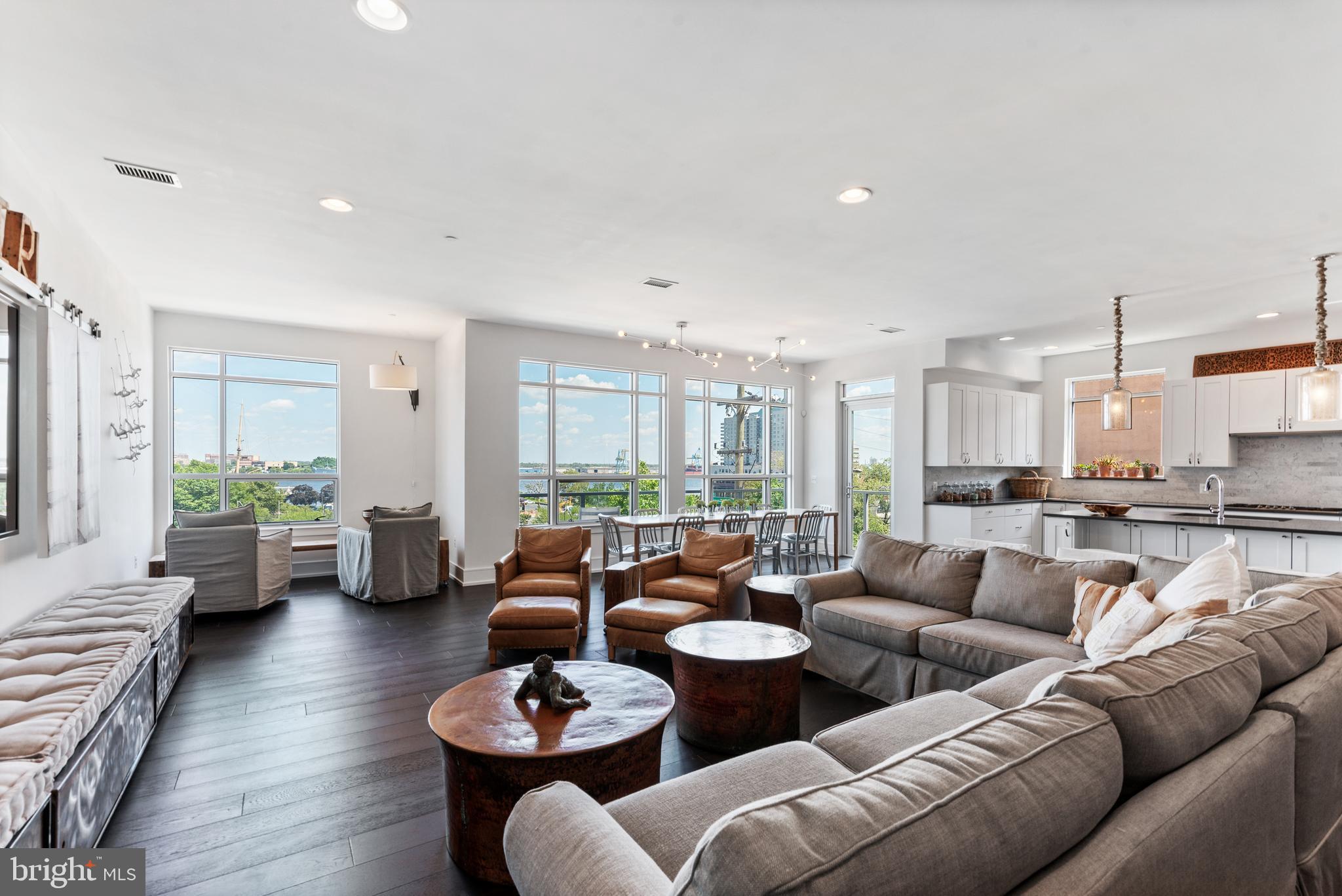 Welcome home to Unit 303 at 410 S Front Street: This corner location, sun drenched condo defines luxury in every aspect! Boasting 2,177 square feet of living space, which is larger than the other 2 Bedroom, 2 Bathroom units in this 55 unit building and the only 2 Bed + Den Unit with a view of the garden from the back balcony. This condo features 2 large, light-filled bedrooms and a flex-space den that can be converted into a personal yoga studio, workout room, or an in home office. Located on the 3rd floor of the building, this single level condo has the most breathtaking views of the river from the front balcony, along with romantic views of the garden from the second balcony off the master bedroom. Upon entering, enjoy a grand entrance way that leads into the state-of-the-art kitchen with Custom Center Island Storage Cabinets, Gaggenau Kitchen Appliances, and large windows that invite the perfect amount of light. The grand room is fit for the host that enjoys large soirees, allowing for over 30 people to gather and relax! The balcony off the grand room allows for guests to sit comfortably as they enjoy the views. The Master bedroom is much like a private oasis with a balcony overlooking the gardens, a luxury soaking tub in a marble drenched bathroom, and a massive walk-in custom closet. The guest bedroom also overlooks the gardens and features large windows in a sun filled space. The bedrooms include custom automated shades which allow minimal light and create a comfortable nights sleep. There is no lack of convenience, INCLUDED are 3 secure parking spaces that have direct access underground and the ability to remotely open the garage from the comfort of your gorgeous home, along with a 24/7 front desk concierge & doorman.

Storage will never be an issue with two grand coat closets at the entry, a great room storage closet, private secured storage unit in the garage, and the most incredible built-in walk-in closet in the master bedroom. With a nominal HOA fee, the building is Pet Friendly and includes an Outdoor Rooftop Patio Lounge with 360 degree views, a Community Garden with Fountain, fully equipped meeting room, and a professionally managed civic association. Enjoy 4.5 years left on the property tax abatement, ease of quick access in and out of the city, and direct access to The Shambles in New Market. Capture all that luxe city living has to offer in this fabulous condo, and schedule your private tour today.