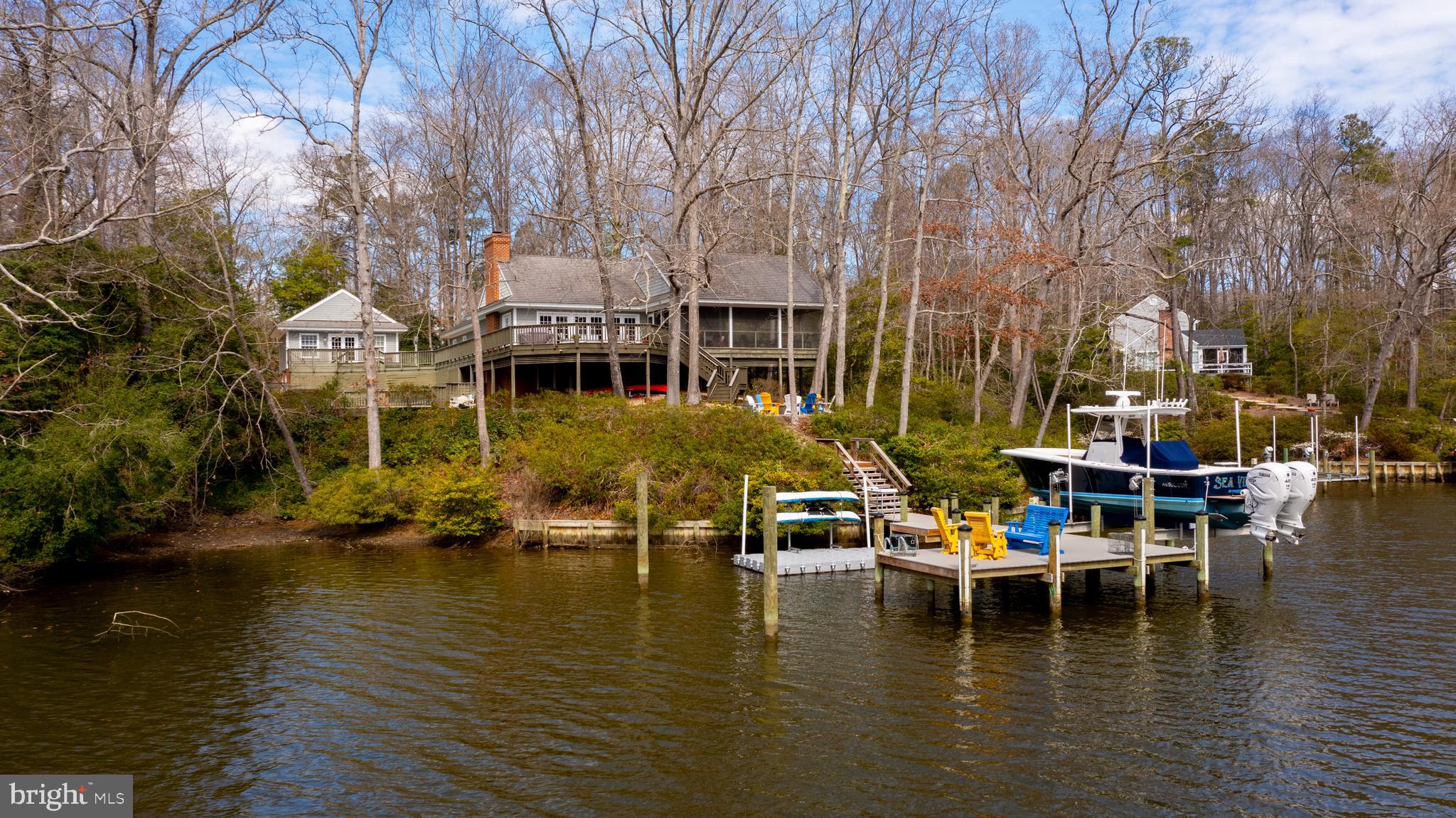 Welcome to waterfront living at its finest in Irvington, VA! This fully furnished luxurious property on Carter’s Creek offers a blend of elegance, comfort, and breathtaking natural beauty. 4,428 square feet of luxurious living space, featuring 3 bedrooms and 3 full baths. Step into the main living area and be greeted by soaring 21-foot cathedral ceilings with exposed trusses, framing a cozy exposed brick fireplace with an antique mantle. The home boasts exquisite details including plantation shutters, open kitchen, dining and great room. The kitchen features Italian ceramic countertops, a double oven, and a convenient brass bar sink. The finished basement provides a fantastic space for entertaining children, and guests. Guests will feel right at home in the charming guest house, complete with its own full bath for added privacy and comfort. Outside, enjoy the ultimate waterfront lifestyle with a covered screen porch, fire pit, dock and boat lift, a floating dock, and in ground pool for endless days of relaxation and recreation. Take advantage of the waterfront lifestyle with your private dock, offering easy access to Carter's Creek, the Rappahannock River and Chesapeake Bay for boating, fishing, and endless aquatic adventures. A detached 2-car garage provides ample storage space for vehicles and outdoor gear. Don't miss out on the opportunity to own this remarkable waterfront retreat. Schedule your viewing today and make your waterfront dreams a reality!