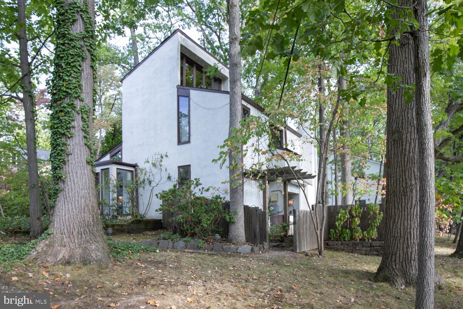 Beauty in The Borough.​ Announcing a First Time Offered Lynn Taylor, Renowned Architect Designed, Original Owner, Contemporary Home !​ Step into the exceptional first floor which features a soaring cathedral ceiling, filling this first floor with light. Also a fireplace, which adds a touch of warmth to enjoy.​ 
Next you’ll find a very charming studio/den, the kitchen and a powder room.​ The second floor includes two bedrooms and a full bath. Located on the 3rd floor, is another spacious bedroom.​ This residence was custom designed and custom built, and is nestled among mature landscaping, which includes a dining terrace, and which provides complete privacy, while being only a short stroll from all the charm of living in historic Doylestown Borough.​ A One-of-a-kind Exceptional design & location !  The photos are virtually staged.