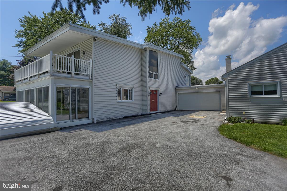 An unbelievable opportunity ! 2 homes on one parcel in Silver Springs Township. Perfect for "in-law" quarters, a rental income or if you ever wanted to have a air B&B this could be the one for you! Situated on a corner lot, the main home boasts a Sunroom with great Southern exposure, Hearth with Pellet Stove, Laminated flooring , kitchen with everything a cook could want, including a warming drawer, food file and additional pantry. Beautiful winding staircase with skylights. Master bedroom has a sauna, full bath with Whirlpool tub/shower, large cedar lined closet with lighting, even a "secret" hide away closet!  "Rooftop" access for star gazing! Need room to park your "Classics Cars? This property boast a 6 car integral garage underneath the main house, a 2 car garage between the guest house and main house and a large detached 2 car garage with and  upper level! That's parking for 10 cars!!!  The GUEST HOUSE has 2 bedrooms, large closets, eat in kitchen, full bath, living room, central vacuum, air conditioner, basement with washer and dryer. All windows in guest house were replaced in 2002.