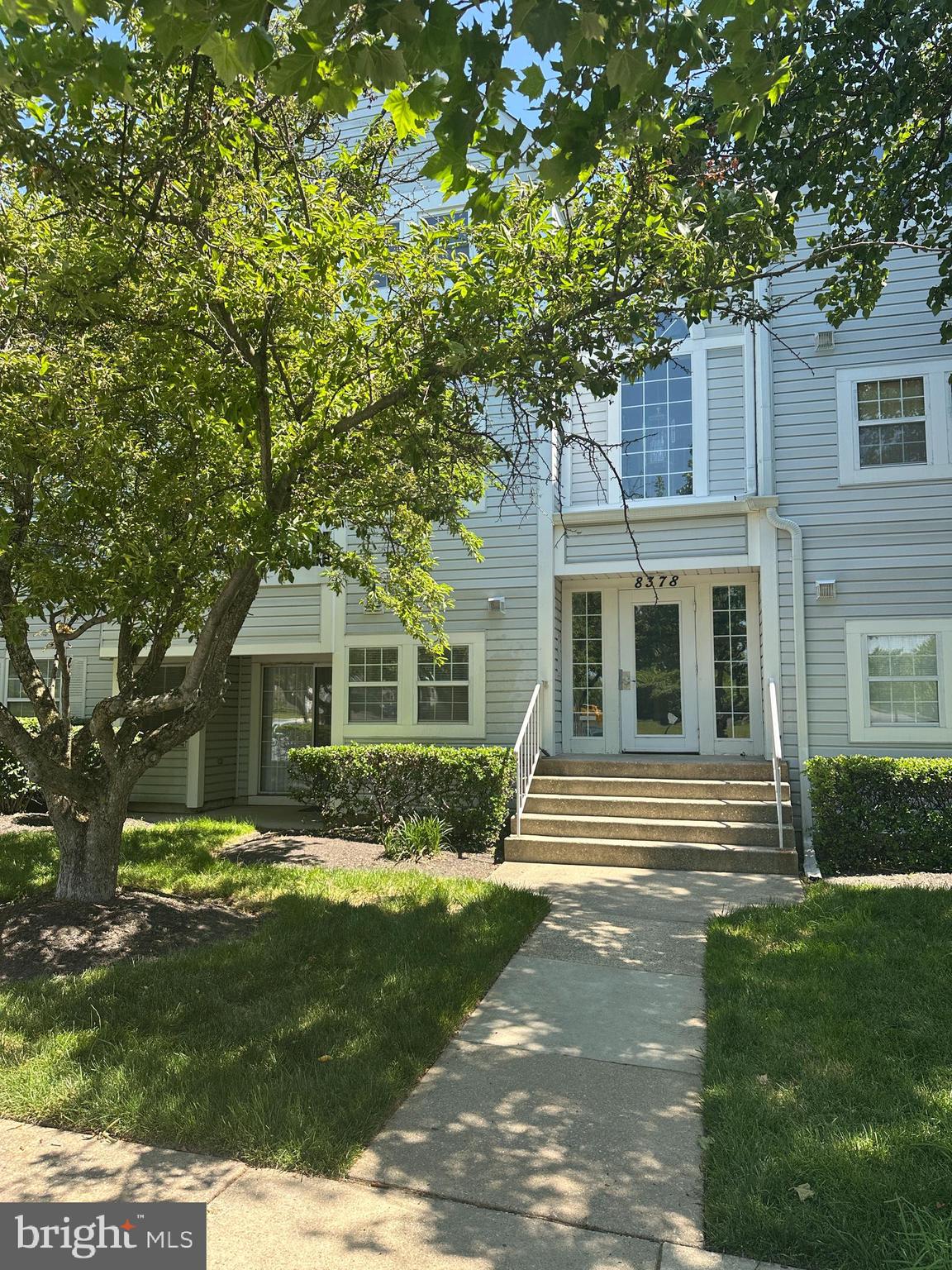 Beautifully renovated 2‑bedroom, 2‑bath patio‑level condo in true move‑in condition. This freshly painted unit features new laminate wood flooring, granite counters, updated baths with custom tile, and new light fixtures throughout. Major systems are already taken care of with a new commercial‑grade water heater and a recently replaced heat pump. Enjoy easy outdoor access from the porch‑level patio.  The community offers two pools, open green space, and a tot lot, all conveniently located near shopping and restaurants. With plenty of parking, including one assigned space, this well‑kept community provides a low‑maintenance, easy lifestyle where everything is done for you.