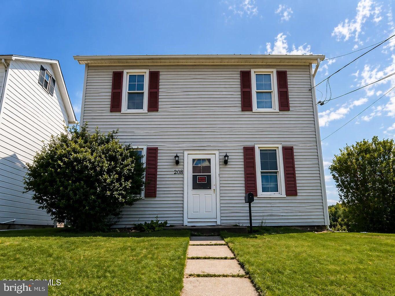 Spacious 3-bedroom, 1.5-bath home offering approx. 1,800 sq ft with a level, fenced yard and large off-street parking area in the rear. Main floor features a living room, dining room, kitchen with pantry, convenient first-floor laundry closet, half bath, and a flexible room that can serve as a bedroom or additional living space. Enjoy the enclosed 3-season rear porch. Upstairs includes the main bedroom, full bath, and a pass-through room off the primary that works well as a home office or potential bedroom (not counted). Walk-up attic provides great storage, plus a storage shed for added space.