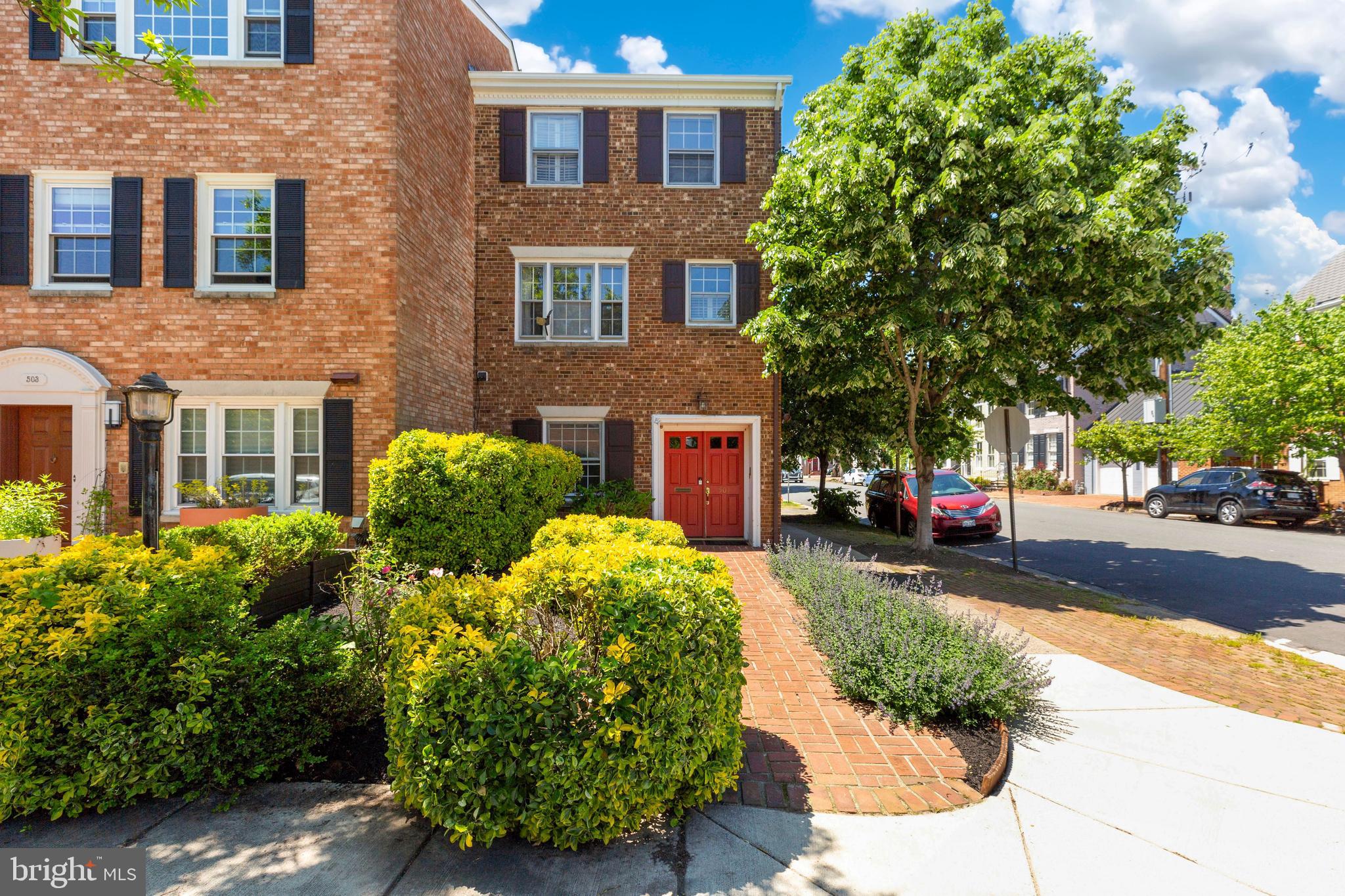 Light-filled end unit townhome in the heart of Old Town.  Walkable to everything! Gardens and double door entry at the front. Renovated kitchen with stainless steel appliances and granite countertops.  Remodeled bathrooms.  Tons of character with hardwood floors throughout, two fireplaces, built-in bookcases, wet bar in the family room, plantation shutters and crown molding.  French doors  from the entry level family room lead to a fully fenced private all brick patio with garden and trees to provide shade.    Parking on street in patio/driveway curb cut for property. Easy access to grocery, shops, restaurants and public transportation. Direct commute to DC along the GW Parkway.