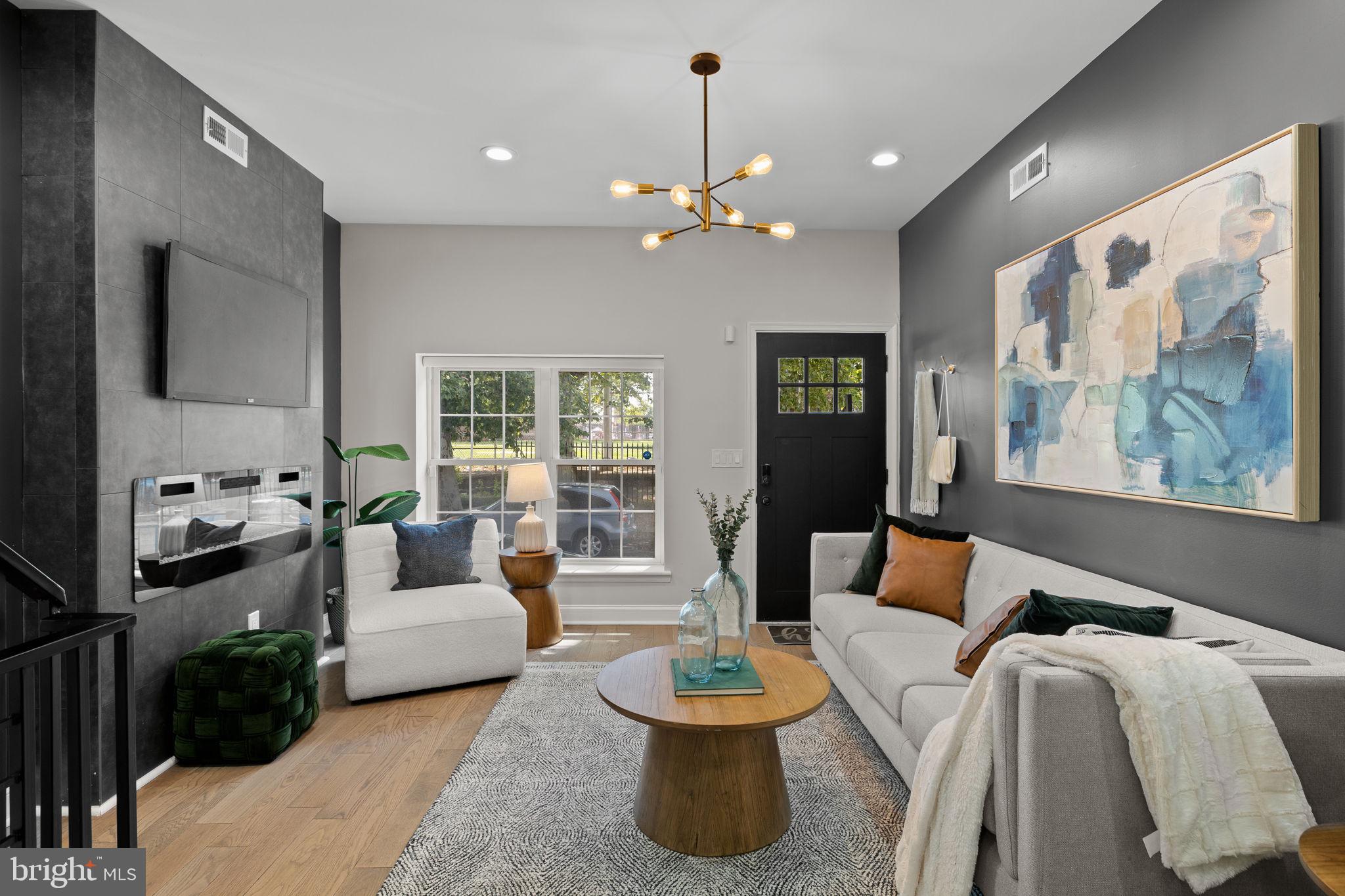 Searching for a home immersed in nature? Don't miss this impressive city home across the street from Brewerytown Garden and the 5.5 acre Athletic Square Park. With 100-year old London Plane Trees across the street, this charming renovation impresses immediately with elevated interior finishes and a private roof deck with views of Center City Philadelphia. Enter to an open main level where the living area flows seamlessly through the dining area to the modern kitchen. On the second level, two well-apportioned bedrooms are bifurcated by a hallway bathroom and laundry. The third level presents an oversized primary bedroom suite with spacious primary bedroom, walkthrough closet with custom installation, and a primary bathroom showcasing a soaking tub, double vanity, and walk-in shower. Incredible roof private roof deck. Convenient to Center City Philadelphia, SEPTA transit, and only a block from Together Skateboarding Coffee! Visit an open house this weekend or schedule your private showing today!