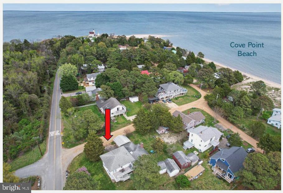 Unique Coastal Opportunity – A Rare Find - Cove Point Beach!
Discover the potential of this one-of-a-kind property, ideally situated on a desirable corner lot just one block from Cove Point Beach and the iconic Cove Point Lighthouse. Brimming with character and decades of cherished memories, this nostalgic family retreat offers two separate living spaces—perfect for extended family, rental income, or a private coastal getaway.
The left side features a 2-bedroom, 1-bath apartment complete with an enclosed porch and a fireplace (unused in recent years). The right side includes a 1-bedroom apartment, enhanced by a permitted second-story addition (built in 2009). The upper level—designed as a spacious great room or creative studio—can be accessed via a spiral staircase or directly from the deck. (Note: no additional bedrooms were permitted on the second floor.)
Additional highlights include:
Detached garage—ideal for storing a golf cart or beach gear
Classic “crab shack” perfect for entertaining, crab feasts, and gatherings
Outdoor shower for easy beach living
Shared central utility area with HVAC, propane heat, washer/dryer, and a functional half bath

. Both main-level apartments have been rented independently in the past, offering excellent income potential.. An incredible opportunity to create your own coastal haven or investment property in a sought-after beachside location.
Imagine the possibilities and start living the beach lifestyle you’ve always dreamed of !