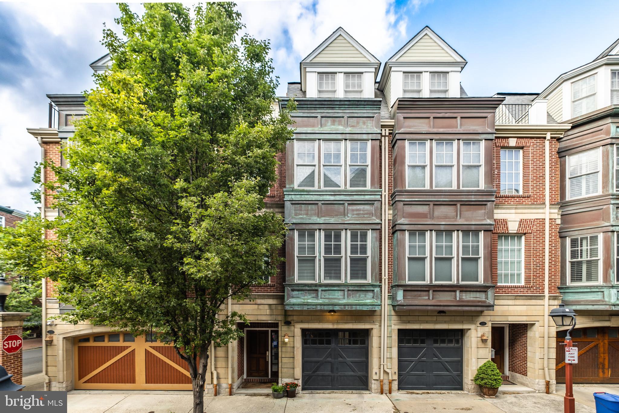 18’ wide, ultra-luxury Society Hill townhome with attached garage in an extraordinary setting unique to Gaskill Street. 1st floor: Dramatic two story entry, attached garage w/ direct interior access, family room with gas fireplace, 1/2 bath and patio that spans the entire width of the property. 2nd floor: ‘great room,’ custom kitchen with 36” viking range, paneled viking refrigerator, wine refrigerator, oversized island that accommodates five comfortably, natural stone counters with slab backsplash and deck perfectly sized to accommodate a grill. Kitchen opens to living/dining room w/bay window overlooking picturesque Gaskill St. Ideal layout for both entertaining and comfortable, modern family living. 3rd floor: over-the-top primary suite with custom walk-in closets, bay window, and luxe, stone-clad ensuite bath featuring two sinks and oversized shower with frameless glass enclosure. Hall laundry with additional storage, and second bedroom with ensuite marble bath. 4th floor: two additional, well-proportioned bedrooms with custom closets/built-ins, hall bath, and private deck with city views. North/South exposure for incredible natural light throughout the day. Amazing features/finishes throughout, immaculately maintained!  Two independent HVAC systems, tankless water heater, and sprinkler system. Just steps to Headhouse Square, neighborhood restaurants, cafes, shopping, and world-class cultural institutions.