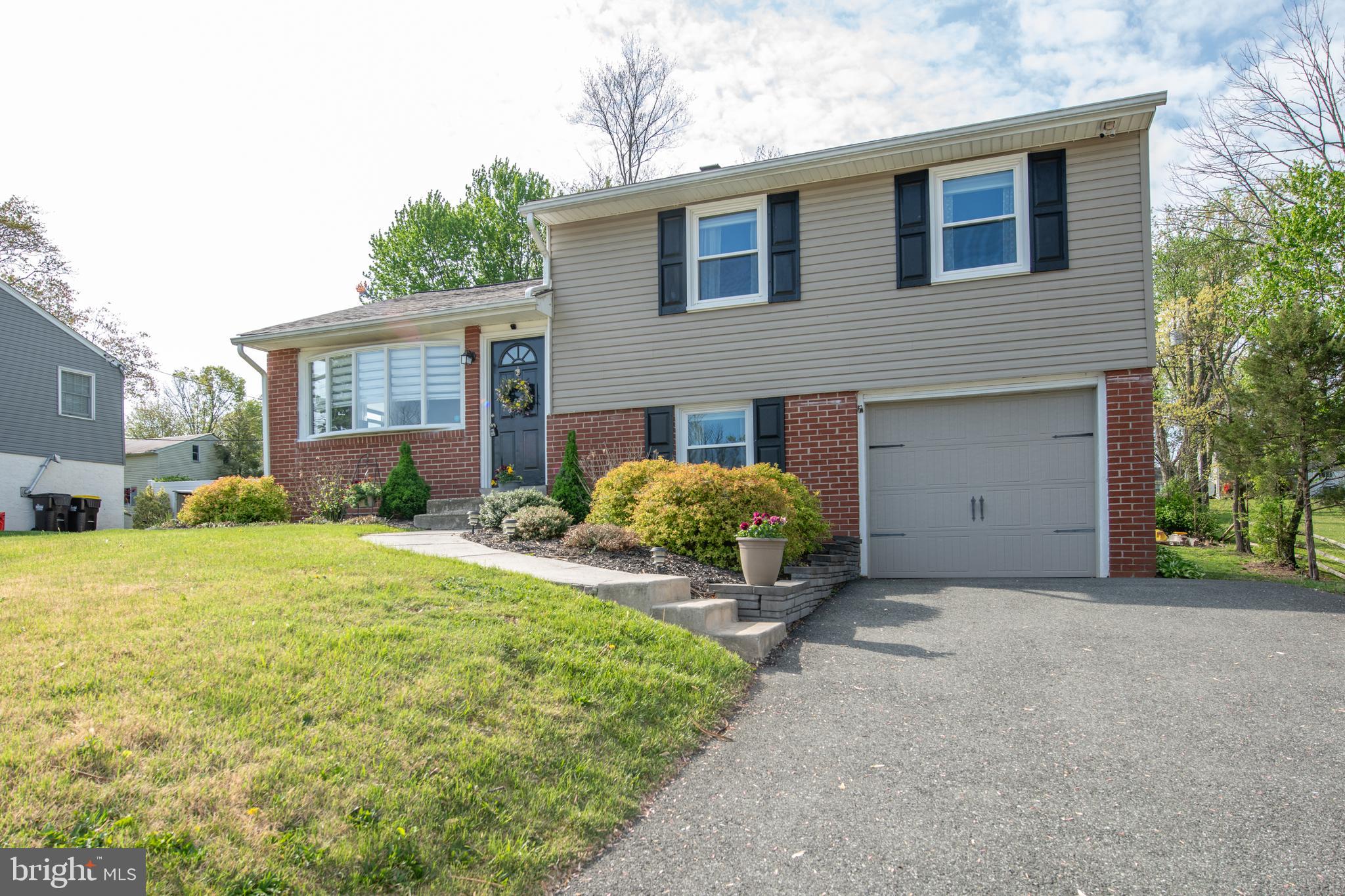 This beautifully maintained single-family home in the highly desirable Perkiomen Township offers a blend of modern upgrades and timeless charm. Situated on a quiet street, the property features a sunlit living room with gleaming hardwood floors and custom paint. Recent updates include new windows installed in 2022 (excluding the kitchen) and a new roof added in 2024. The remodeled kitchen boasts tile flooring, white cabinets, granite countertops, and newer appliances. An elegant dining room with bright sliding doors leads to a spacious backyard oasis, perfect for relaxation and entertaining. The fully finished basement serves as a versatile space, ideal for a family room, media, or game room, and includes plush carpeting, a powder room, and a separate laundry area. Upstairs, the immaculate bedrooms feature hardwood floors, custom paint, and ample closet space. Both bathrooms are updated with ceramic tile, modern sinks, and light fixtures. Additional highlights include maintenance-free siding, newer gutters and downspouts, a 200-amp electrical service, and an automatic garage door. Enjoy the expansive, lush backyard from the comfort of your covered back porch. Located just minutes from Skippack Village, Providence Town Center, and major routes like Rt. 29, 113, and 422, this home offers convenient access to shopping, dining, and entertainment options. Perkiomen Township's housing market remains strong, and the area is recognized as one of the top suburbs to buy a home in the Philadelphia region. Don't miss the opportunity to own this dream home in a thriving community!