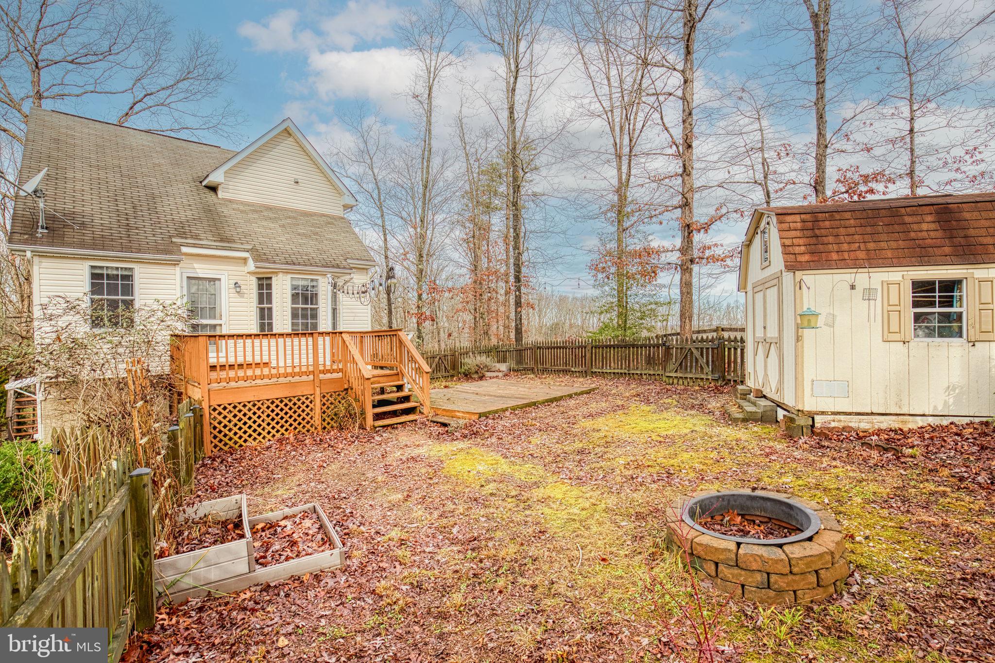 Privacy, Privacy, Privacy--3 acre secluded wooded homesite.  Close to Spotsylvania VRE and Cosner's Corner for all your shopping and restaurants. Main level has primary bedroom with large walk-in closet and screened porch off of the primary bedroom. Main level also has family room, full bath, and kitchen with dinette that leads to the back deck and fenced rear yard. Top floor has two bedrooms and full bath. The basement includes a huge family room, half bath, laundry room with washer and dryer, and small storage area. Plenty of parking to include a 2 car detached carport. This is a MUST SEE in order to appreciate how unique and private this property is.