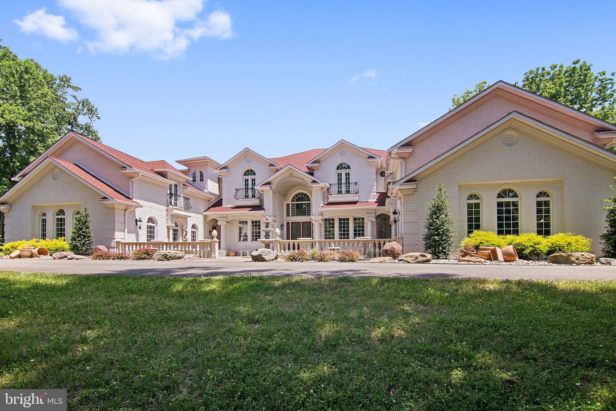 BACK ACTIVE ... PENDING RELEASE...EXQUISITE.. Custom Built Home with over 10,000  sq.ft of living, 5 acres  of land, 6 bedrooms of which include 3 master style  suites each with private baths, 6+ bathrooms,separate in-law suite apartment with full kitchen, washer and dryer. 4 car garage, Media room,Gym, Game Room, Elevator, Ballroom and catering kitchen , wet bar, 2 covered outside verandas & A MUST SEE