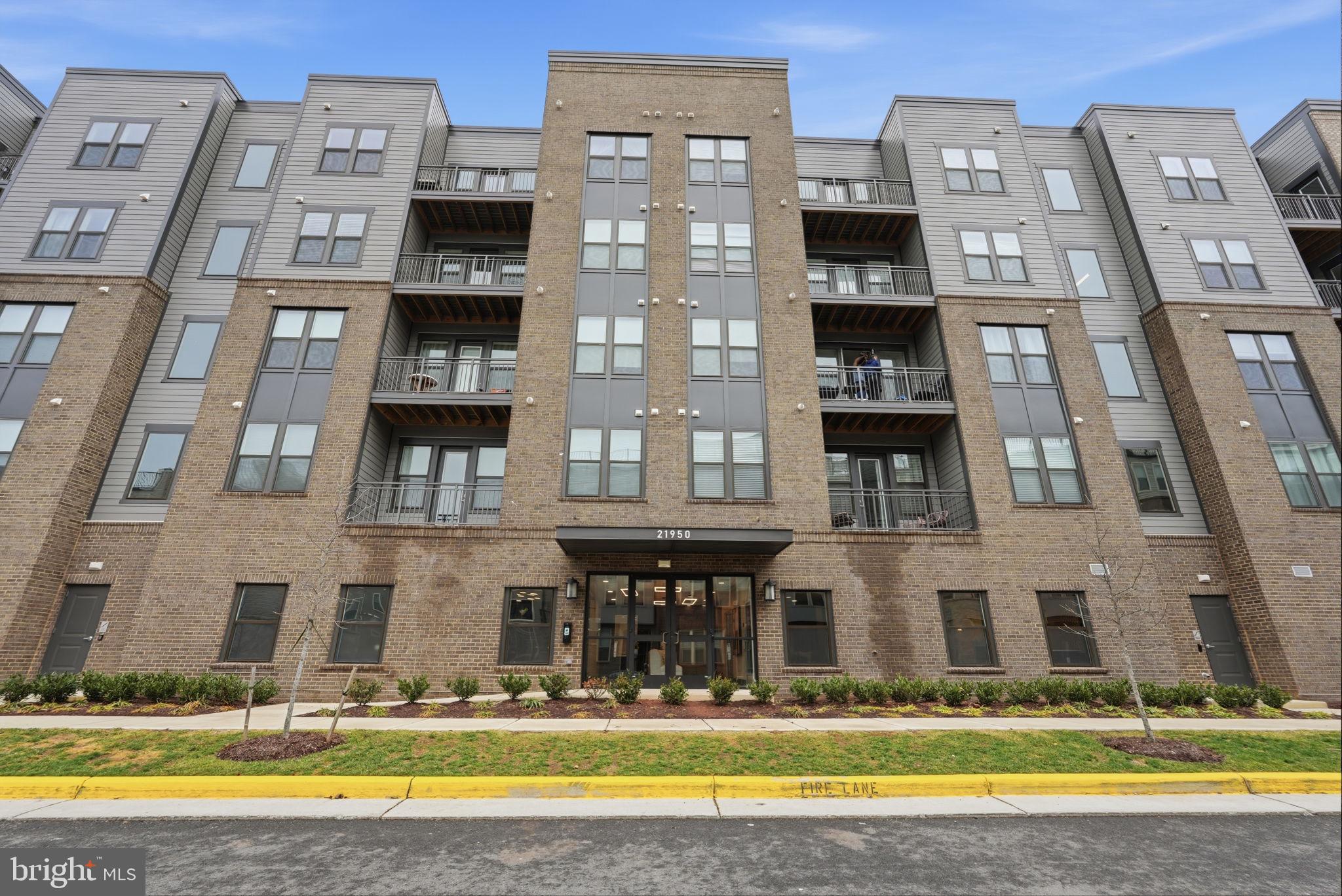 Welcome to this beautiful 2-bedroom, 2-bath luxury condo located on the top floor in the sought-after Residences at Waxpool Crossing in Ashburn. Built in 2024, this modern home features an open-concept floor plan with approximately 1,300+ square feet of stylish living space. 

The gourmet kitchen includes stainless steel appliances, upgraded countertops, and a large island that flows seamlessly into the dining and living areas—perfect for entertaining. Enjoy luxury vinyl plank flooring in the main living spaces, cozy carpeted bedrooms, and a spacious primary suite with a walk-in closet and spa-like bath. Step outside to your private balcony for fresh air and relaxation. 

Working from home? You will love the home office space right by the entryway. Additional highlights include in-unit washer and dryer, elevator access, and a reserved garage parking space with extra parking on the street. Residents enjoy fantastic community amenities including a lounge, community room, dog park and grooming spa, gym facility, and outdoor pavilion with grills and fire pit. 

Conveniently located near major commuter routes, the Silver Line Metro, shopping, dining, and Dulles Airport. Available now!