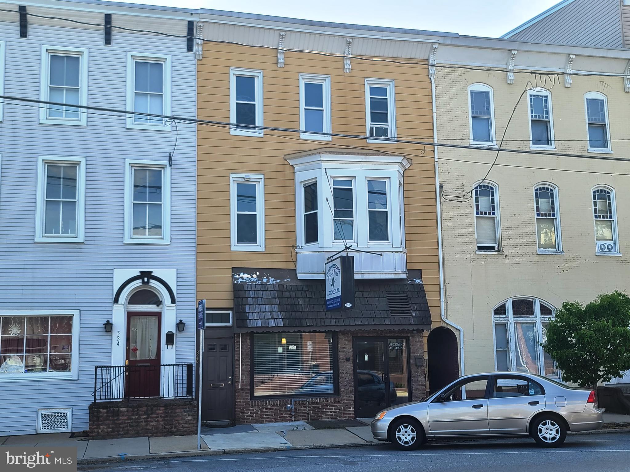 This first floor office space was completely remodeled in 2017, and features an 1,386 sq. ft. area consisting of a secretary station, conference room, private office, kitchenette, two cubicles, ADA Compliant bathroom, a Network Closet, and a storage room. Many original characteristics of this building were retained in remodeling, all the while bringing the space up to Code, and creating the modern layout. $1,848/mo. rent.