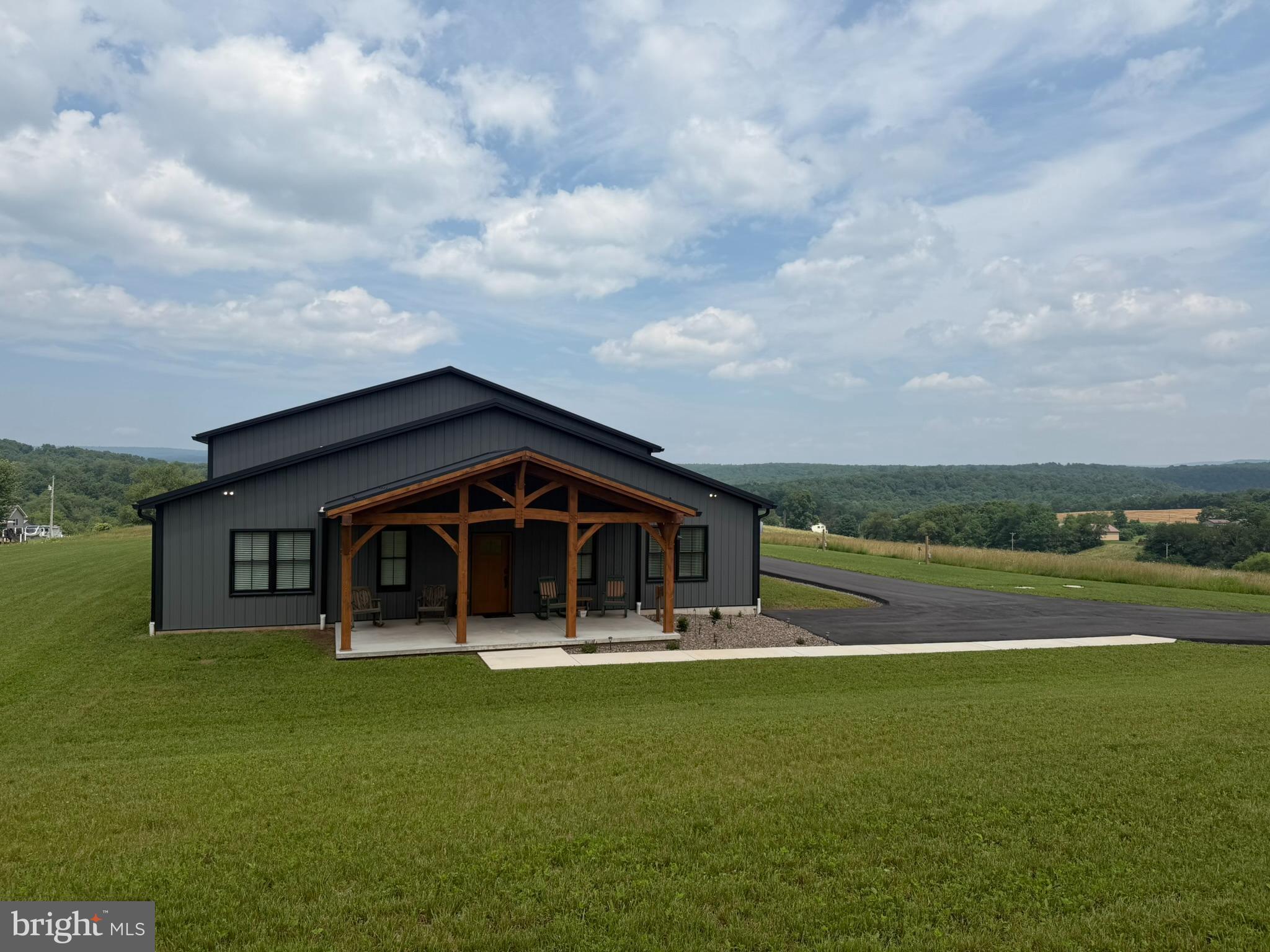 A Truly One-of-a-Kind Raystown Retreat! Situated on approximately 75 breathtaking acres, this exceptional property offers the perfect combination of luxury, recreation, and privacy. Featuring approximately 50 acres of premier wooded hunting ground, the land is loaded with wildlife, including impressive trophy-sized deer, and is already equipped with multiple established tree stands for the avid outdoorsman.

Built just two years ago, the beautifully maintained barndominium is in impeccable condition and offers comfortable one-level living with 2 bedrooms, 2 full baths, gorgeous wood flooring, and warm cabin-inspired finishes throughout.

The oversized heated and air-conditioned garage is designed to accommodate all your needs, featuring a 16-foot overhead door, Tesla charging station, and RV electrical hookup. The property also includes multiple new wells and two full RV hookup sites with electric and water, making it ideal for guests, family gatherings, or additional recreational use.

Enjoy spectacular panoramic views, unmatched privacy, and endless opportunities for hunting, hiking, ATV riding, or simply relaxing in nature—all while being just 3 miles from the main entrance to Raystown Resort. Whether you're searching for a year-round residence, hunting lodge, or private getaway, this remarkable property offers an opportunity that rarely comes available.
