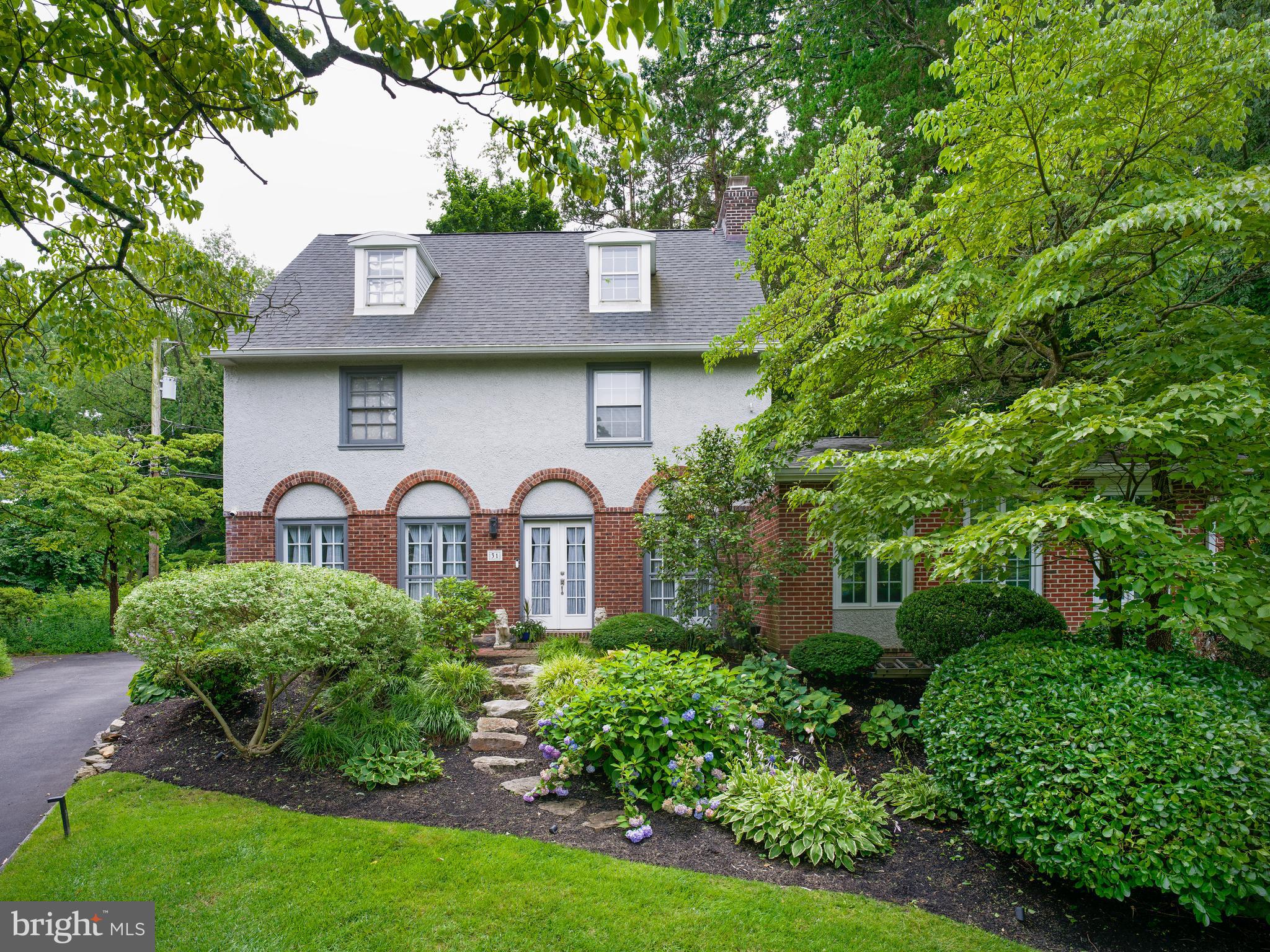 Set on a quiet cul-de-sac behind lush, professionally landscaped gardens in one of Bala Cynwyd's most desirable neighborhoods, this beautifully updated five-bedroom residence seamlessly blends timeless architecture with thoughtfully renovated living spaces and exceptional indoor-outdoor entertaining. Located within the award-winning Lower Merion School District and just moments from the Cynwyd Heritage Trail, regional rail, parks, shopping, dining, and Center City Philadelphia, the home offers the perfect balance of privacy, convenience, and everyday luxury.

A charming front entry welcomes you into a gracious center hall that immediately showcases the home's classic layout. Straight ahead, the formal living room is anchored by a handsome wood-burning fireplace and framed by rich hardwood floors, elegant millwork, and oversized windows that fill the space with natural light. To the right, the expansive family room features soaring vaulted ceilings, walls of windows, and direct access to the rear patio, creating a seamless connection between indoor and outdoor living. To the left of the foyer, the formal dining room offers an inviting setting for both everyday meals and special occasions and is conveniently complemented by a nearby powder room. Beyond the dining room, the eat-in kitchen delivers crisp white cabinetry, stainless steel appliances, sleek soap stone counters, abundant workspace, a breakfast area, and a secondary staircase providing convenient access to the upper level.

The second floor hosts three bedrooms, including a serene primary suite with a wall of closets and a beautifully updated en-suite marble bath featuring an oversized glass shower with dual shower heads, pebble-stone floor, and rich double-sink vanity. Two additional bedrooms on the third floor share a well-appointed full bathroom with dual shower heads, creating an ideal space for guests, home offices, or flexible living arrangements.

The outdoor living spaces are where this home truly distinguishes itself. Designed as a natural extension of the interior, the private backyard is perfectly suited for entertaining and everyday enjoyment. Gather around the impressive outdoor kitchen and bar, and built in professional grade grill with a natural gas hookup, host dinners on the expansive patio, unwind beneath the custom pergola in the luxurious hot tub, watch the game on the outdoor television, or simply relax while children and pets enjoy the beautifully landscaped yard surrounded by mature trees, and customized exterior lighting controlled by an app with hundreds of custom light color options. Despite its incredibly convenient location, the property offers a remarkable sense of privacy and tranquility that's increasingly difficult to find.

An unfinished basement offers abundant storage and exciting potential for future finished living space, while the detached one-car garage and backyard shed provide additional parking and storage for daily convenience.

Presenting five bedrooms, beautifully updated interiors, outstanding outdoor entertaining spaces, and an exceptional Main Line location, 31 Snowden Road is more than a beautiful home; it's a place where everyday living feels like a retreat.
