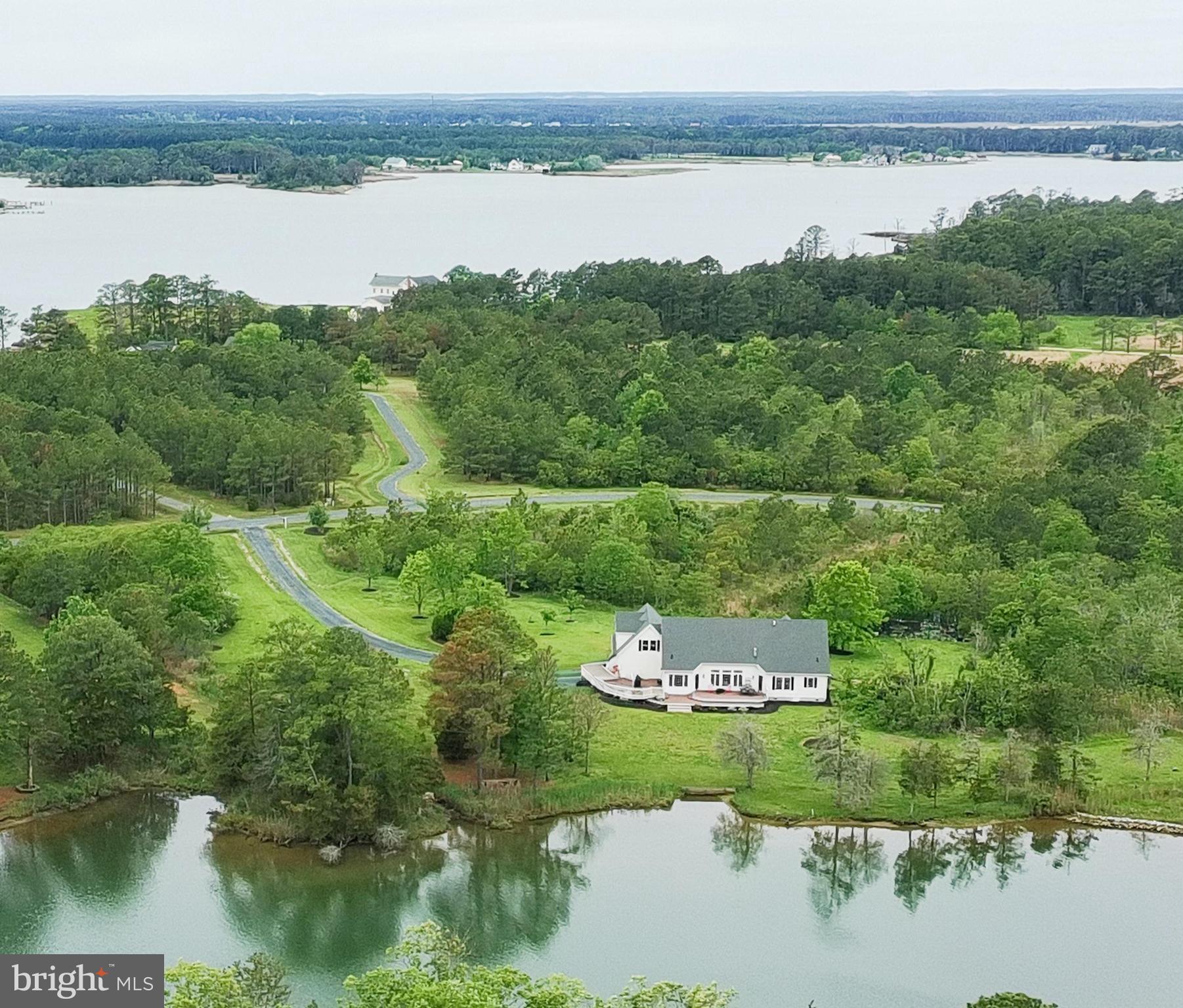 Enjoy peaceful waterfront living in this beautiful Cape Cod set on 5.5+/- acres along protected Webbs Creek/Fishing Creek, just minutes from the Choptank River. Designed for comfortable one-level living, the home offers 3 bedrooms, 2 baths, a private home office, dining room, and a spacious great room with vaulted ceilings and a corner stone gas fireplace. Expansive windows and doors open to an impressive  1,000 +/- sq. ft. waterside deck, perfect for entertaining or simply taking in the tranquil views. Horses are permitted on the property, adding flexibility and rural charm.
The waterside primary suite features a tray ceiling, direct deck access, and beautiful water views. The en-suite bath includes a jetted soaking tub, double vanity, separate glass shower, and an oversized walk-in closet. The custom kitchen is well equipped for cooking and gathering with stainless steel appliances, a large pantry, ample prep space, and freshly painted cabinetry, complemented by detailed molding throughout the home.
Recent improvements include an encapsulated crawl space, high-efficiency heat pump, and Rinnai tankless water heater.
Outdoor living is a highlight—relax on the large deck with morning coffee or evening sunsets while enjoying frequent wildlife sightings including blue herons, eagles, and deer. The oversized two-car garage provides additional space for storage or water toys. A deep-water community dock (approx. 6' MLW) is located at the end of the street, and a private pier is permitted.
The unfinished second level (1,500 sq. ft. +/-) offers excellent potential for additional living space or storage and already includes a bathroom rough-in. This exceptional property combines privacy, nature, and waterfront lifestyle—where every day feels like a vacation.