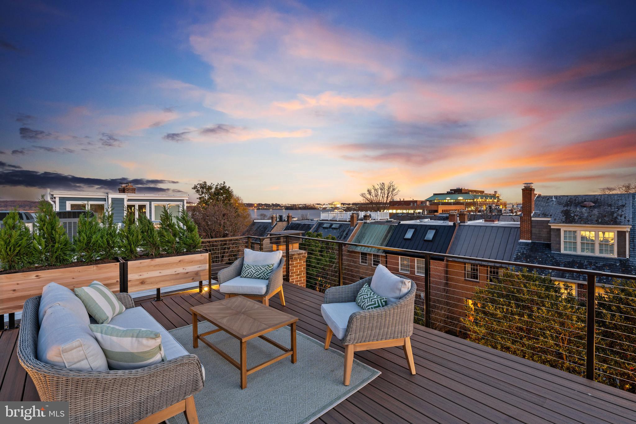 Ring in 2025 with this newly renovated elevator end townhome with Capitol and Potomac River views.  Just steps to the Potomac River, Founders Park and the hussel and bussel of Old Town. Thoughtfully designed with 4 bedrooms, 4.5 baths, and 4 inviting outdoor spaces, a rarity in the city.  

Step into the main living area, where 11-foot coffered ceilings create an airy, elegant atmosphere, and 12-foot glass sliding doors lead to a private stone patio—ideal for relaxing or entertaining. The chef’s kitchen, with its large center island and space for a generous dining table, is the perfect setting for everything from casual meals to lively gatherings, all while enjoying peaceful river views.

The crown jewel of the home is the 528 sq. ft. rooftop terrace, where breathtaking views of the Capitol, Washington DC and National Harbor make every moment unforgettable. Each bedroom is a private retreat with its own ensuite bath, and two feature their own private outdoor decks.

Beautiful wide-plank white oak floors, custom millwork, and thoughtful finishes are found throughout, offering a timeless aesthetic. Completing the home are a one-car garage and an additional off-street parking space plus more garage spaces available just steps away.

Perfectly positioned in Old Town Alexandria, this home pairs everyday luxury with the charm and accessibility of one of the area’s most sought-after neighborhoods. A private fenced back yard for entertaining and no HOA. A perfect lock and leave home for those with busy travel schedules.