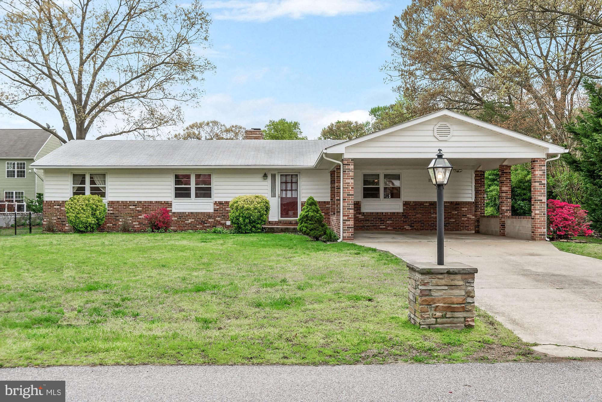 Wonderful Opportunity to Own this 3 Bed 2 Bath Home in Magothy Manor - a Quiet Community with Beach Access! Home Features all Bedrooms on Main Level with Brick Fireplace and Huge Florida Room.  Bay Window, Gleaming Hardwood Floors, and 2 Car Carport. Nice Flat Partially Fenced Lot with Shed.  Amazing Value and Location!