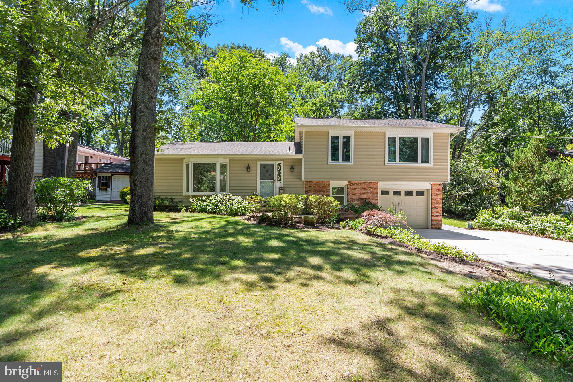 Welcome to 1123 Chinaberry Lane, a beautifully maintained split-level home tucked away on a quiet street in the sought after Sunrise Beach section of Arden on the Severn. Offering 3 bedrooms, 2 full and 1 half baths across four finished levels, this home combines thoughtful updates with charming mid-century modern touches and water-privileged living.

The spacious main level living room is a standout feature, showcasing vaulted ceilings with exposed beams that create an airy, architectural focal point and fill the space with character. Just beyond, the beautifully renovated kitchen offers timeless finishes, abundant custom cabinetry, and an ideal layout for both everyday living and entertaining. The updated hall bath adds style and functionality, while the home's unique design elements and warm character shine throughout.

The upper level features three bedrooms, including a private primary suite with its own en-suite bathroom. The additional bedrooms are well-sized and share the beautifully updated hall bath.

Multiple living spaces provide flexibility for today's lifestyle, including a spacious lower-level family room with half bathroom and an additional unfinished level that is perfect for a home office, gym, playroom, or hobby space. A one-car garage and oversized driveway provide ample parking and storage.

Outside, enjoy the peaceful setting from the updated paver patio overlooking the landscaped yard. Recent improvements provide peace of mind, including a roof (approx. 2018), kitchen renovation (approx. 2017), updated vinyl siding, replacement windows and sliders, basement waterproofing, well pump replacement, updated driveway, and extensive 2026 improvements including interior painting, new family room flooring, freshened landscaping, exterior power washing, and gutter maintenance.

Residents of Arden on the Severn enjoy access to community beaches, piers, boat ramps, playgrounds, and water privileges on the Severn River, along with year-round neighborhood events and a true sense of community. Conveniently located near Annapolis, major commuter routes, shopping, dining, and recreation, this move-in-ready home offers the perfect blend of character, updates, and lifestyle.

*square footage is estimated