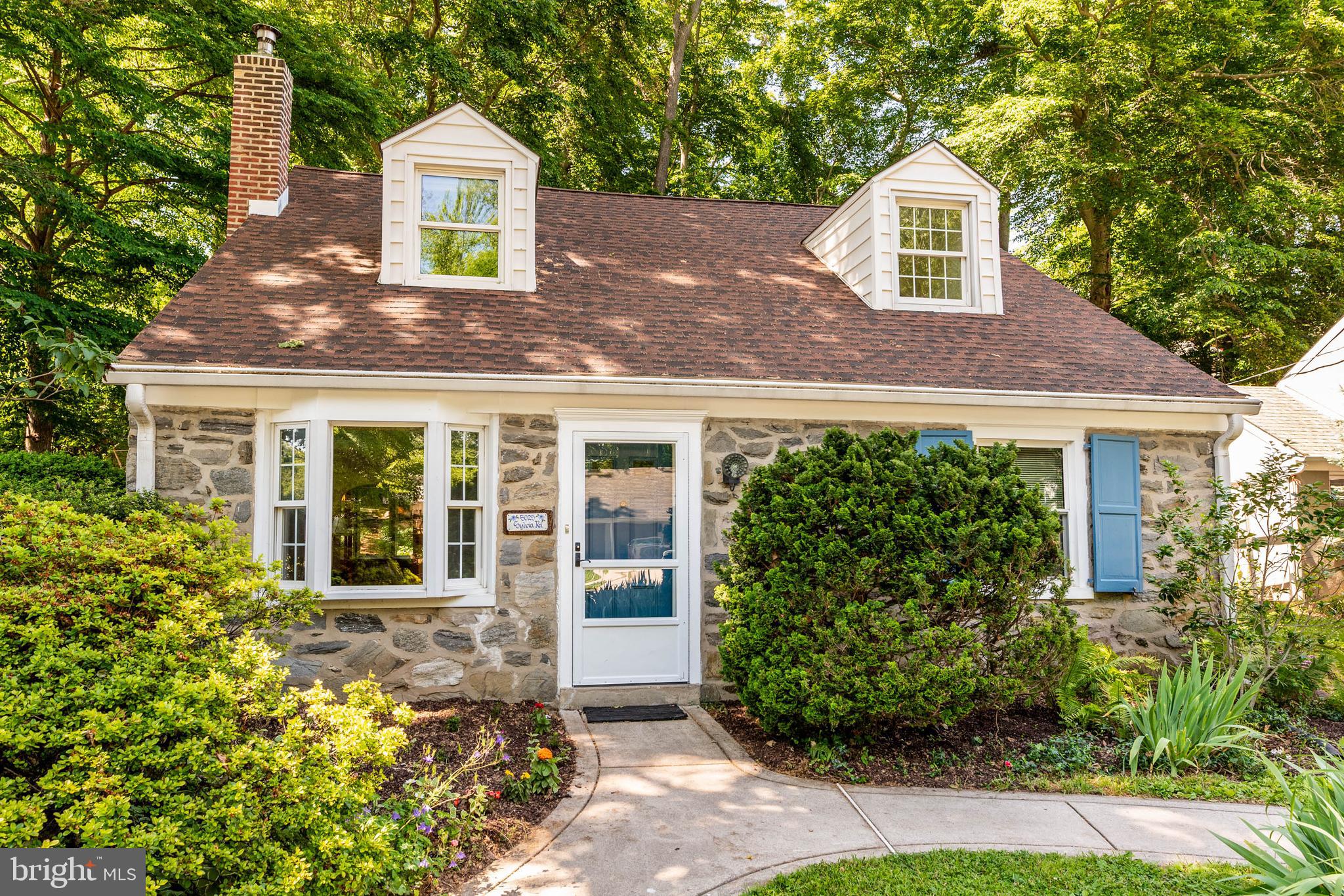 Welcome to 5025 Sylvia Road, a charming 4-bedroom, 2-bath Cape Cod home nestled on a quiet, tree-lined street in the heart of Drexel Hill, PA. This classic early-1950s residence offers timeless character, a functional layout, and an unbeatable location close to schools, parks, and major commuter routes.

The main level features a bright and inviting living area that flows into the dining space and kitchen, creating an ideal setting for everyday living and entertaining. A spacious primary bedroom on this level offers convenient main-floor living, while the second first-floor bedroom is perfect for a home office or nursery. A full hall bath completes this level and enhances everyday practicality.

Just off the main living area, a covered, screened-in porch/three-season room extends your living space outdoors. Completely surrounded by a lush tree canopy and nature, this tranquil retreat provides a peaceful setting for morning coffee, quiet evenings, or casual entertaining while overlooking the yard.

Upstairs, you’ll find two additional bedrooms and a second full bath, providing flexibility for a growing household or multi-purpose spaces. A large attic storage area adds valuable extra space for seasonal items and household essentials, helping keep your living areas uncluttered.

The full, unfinished basement provides excellent storage, future finishing potential, and includes laundry hookups for added convenience. This level offers ample room for a workshop, home gym, or recreation area to suit your needs.

Set on a peaceful, low-traffic block, the property enjoys a classic suburban feel with mature trees and sidewalks that invite evening walks and neighborly connection. The home is within walking distance of the local elementary school, adding everyday convenience for school-day routines.

Don’t miss this fantastic opportunity to own a well-maintained Cape Cod in one of Drexel Hill’s most desirable residential pockets. Schedule your showing today.